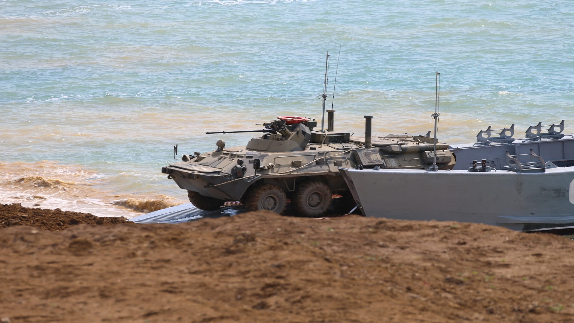 Image for the title: Russia begins drawdown of troops from Ukraine's border 