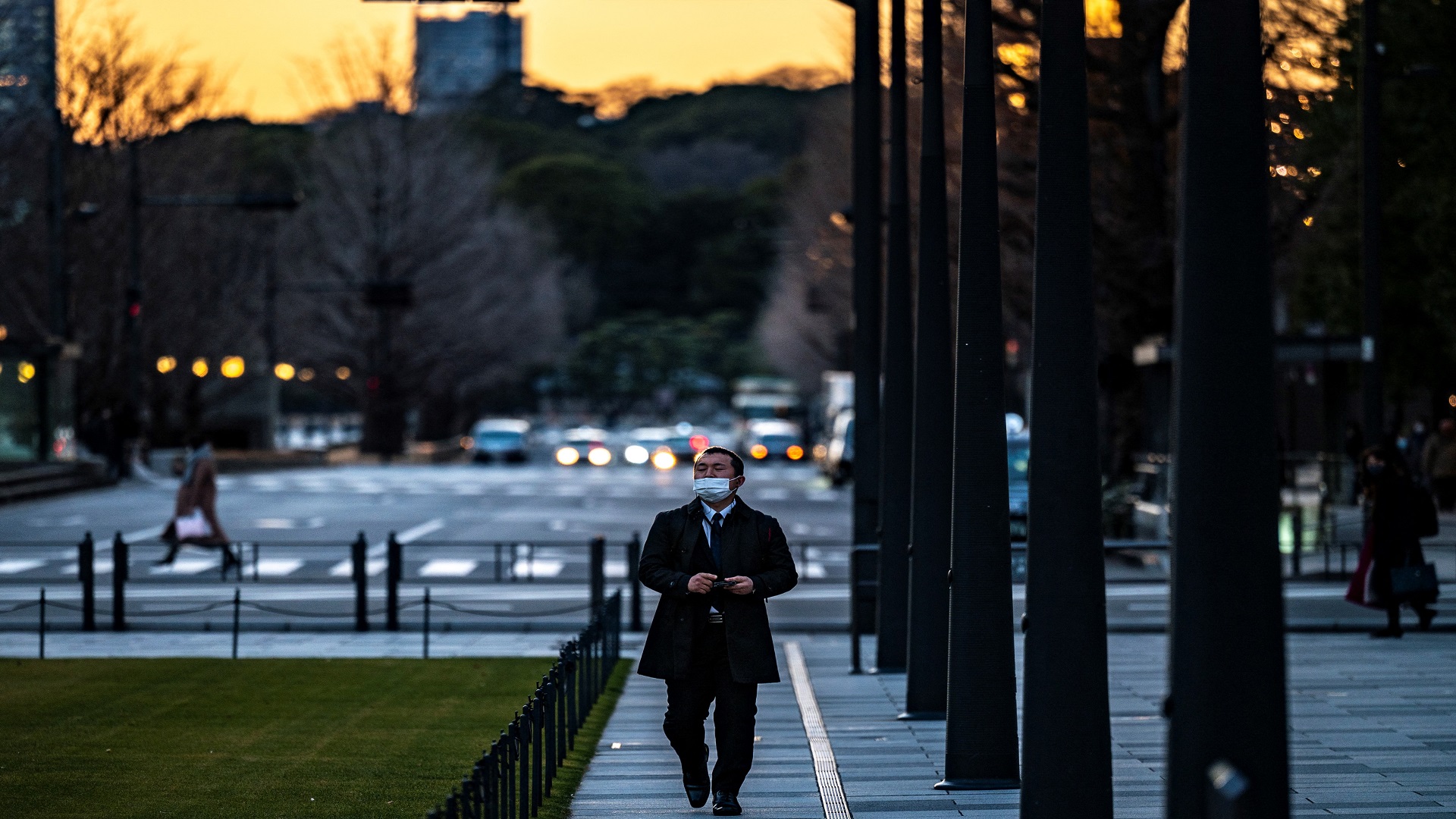 Image for the title: Japan reports 1,588 new virus cases, total at 409,129  