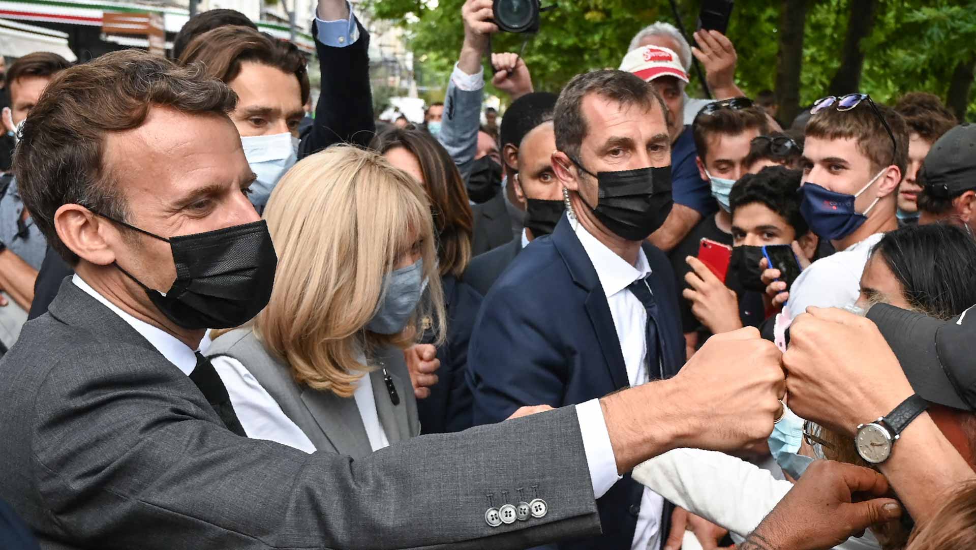 Image for the title: France's Macron slapped in the face while greeting crowd 