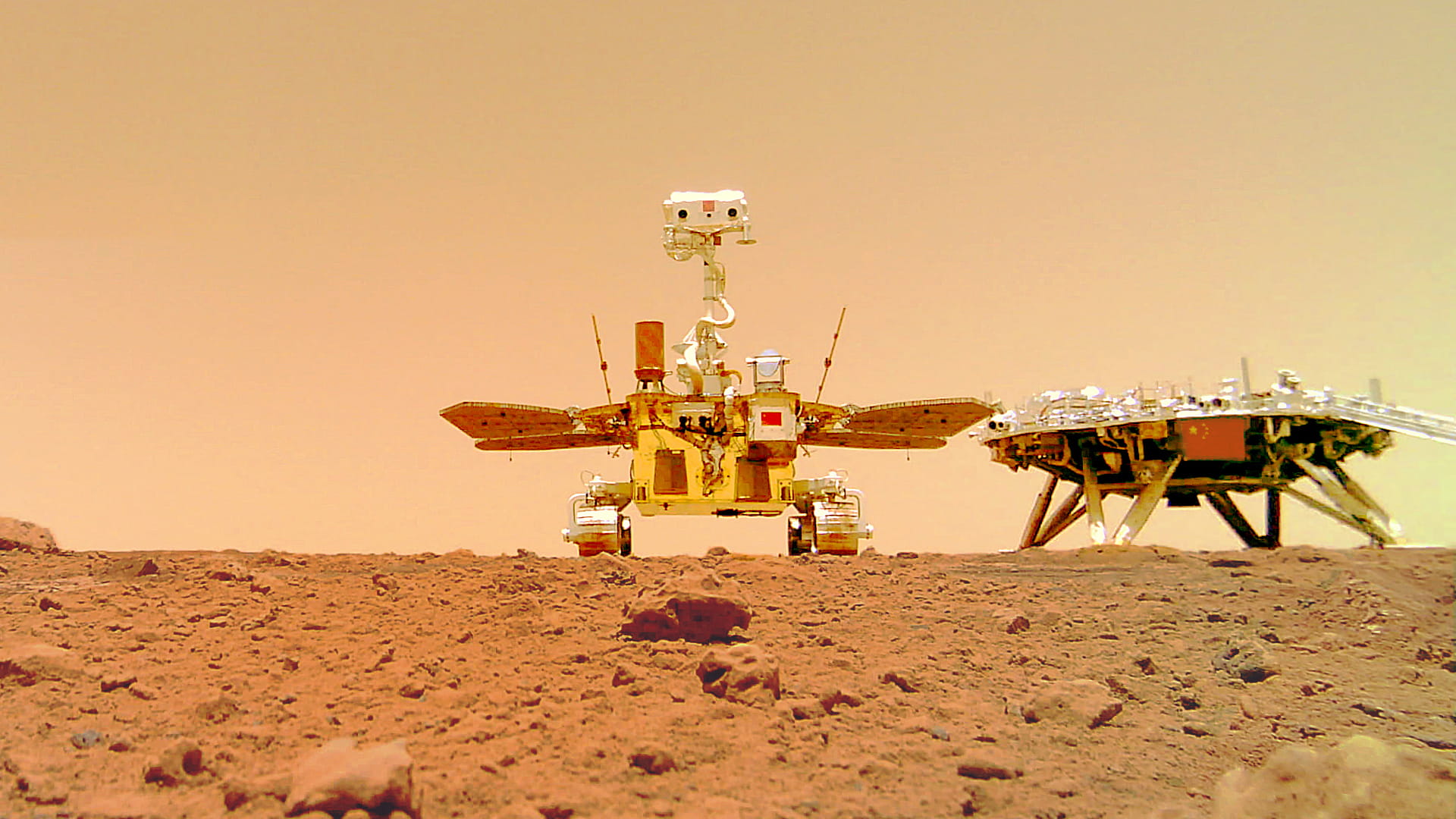 Image for the title: CNSA releases photos of Chinese rover on rocky Martian surface 