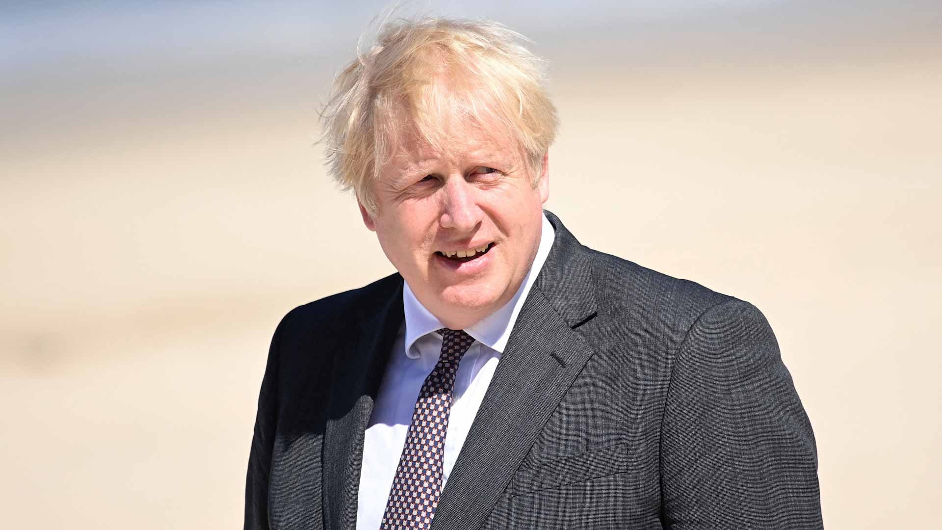 Image for the title: UK PM hints at delay to full lifting of virus curbs 