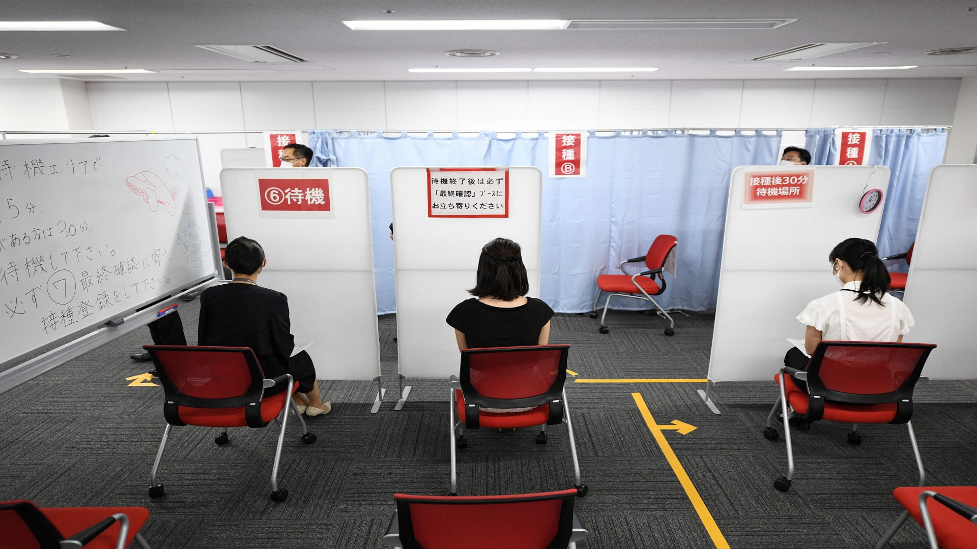 Image for the title: Japan aims to introduce vaccine passports by late July 