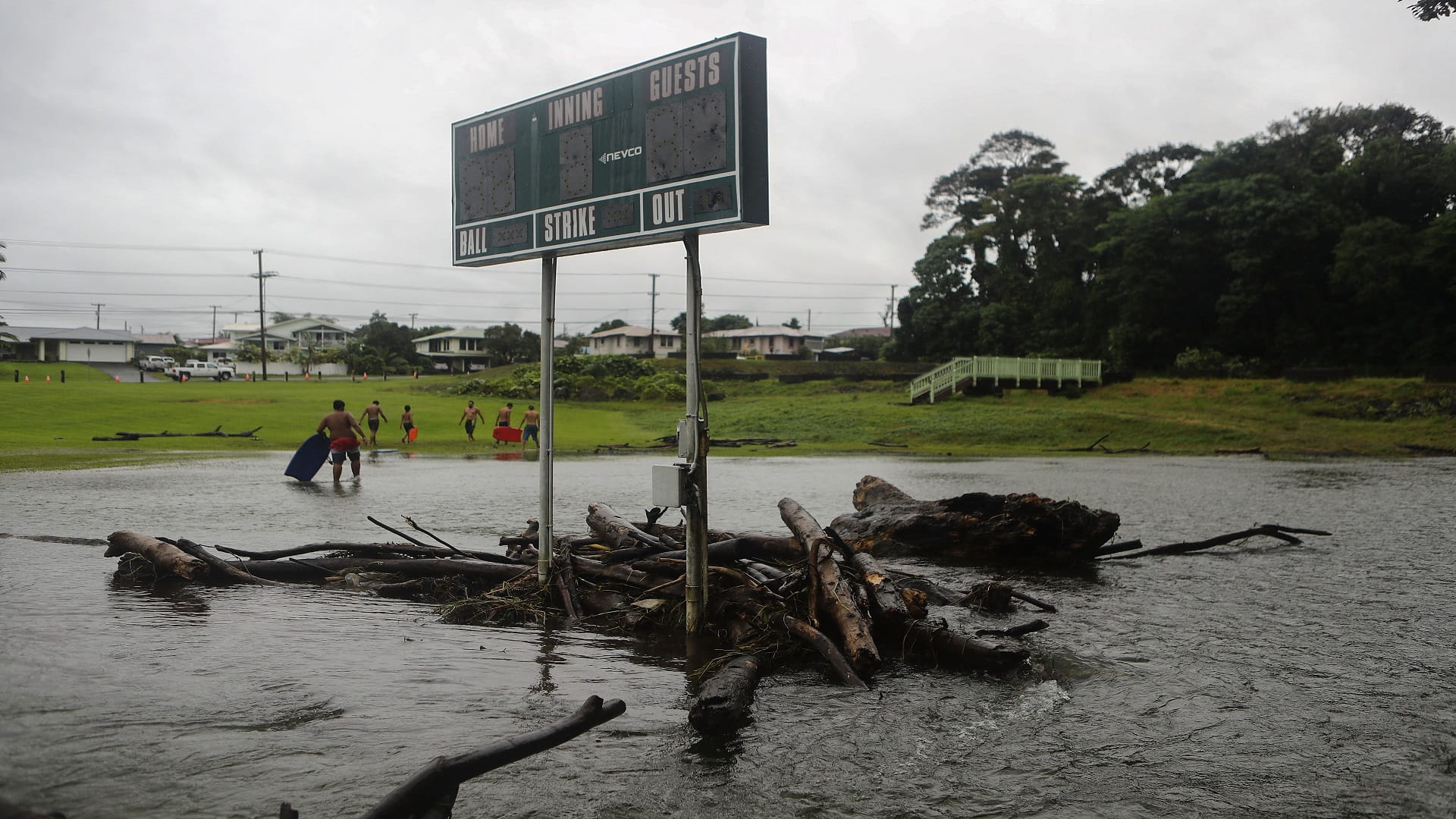 Image for the title: Hawaii opens evacuation shelters after dam breach on Maui island 