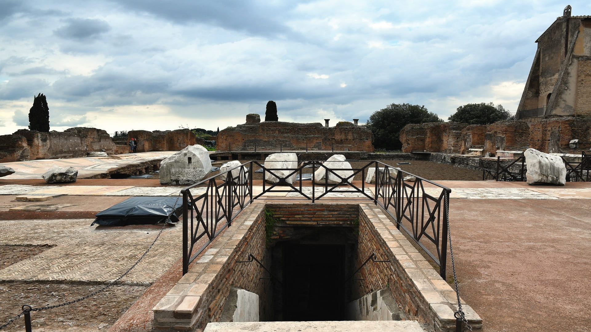 Image for the title: Ancient Roman domus with mosaic floors tucked under modern flats 