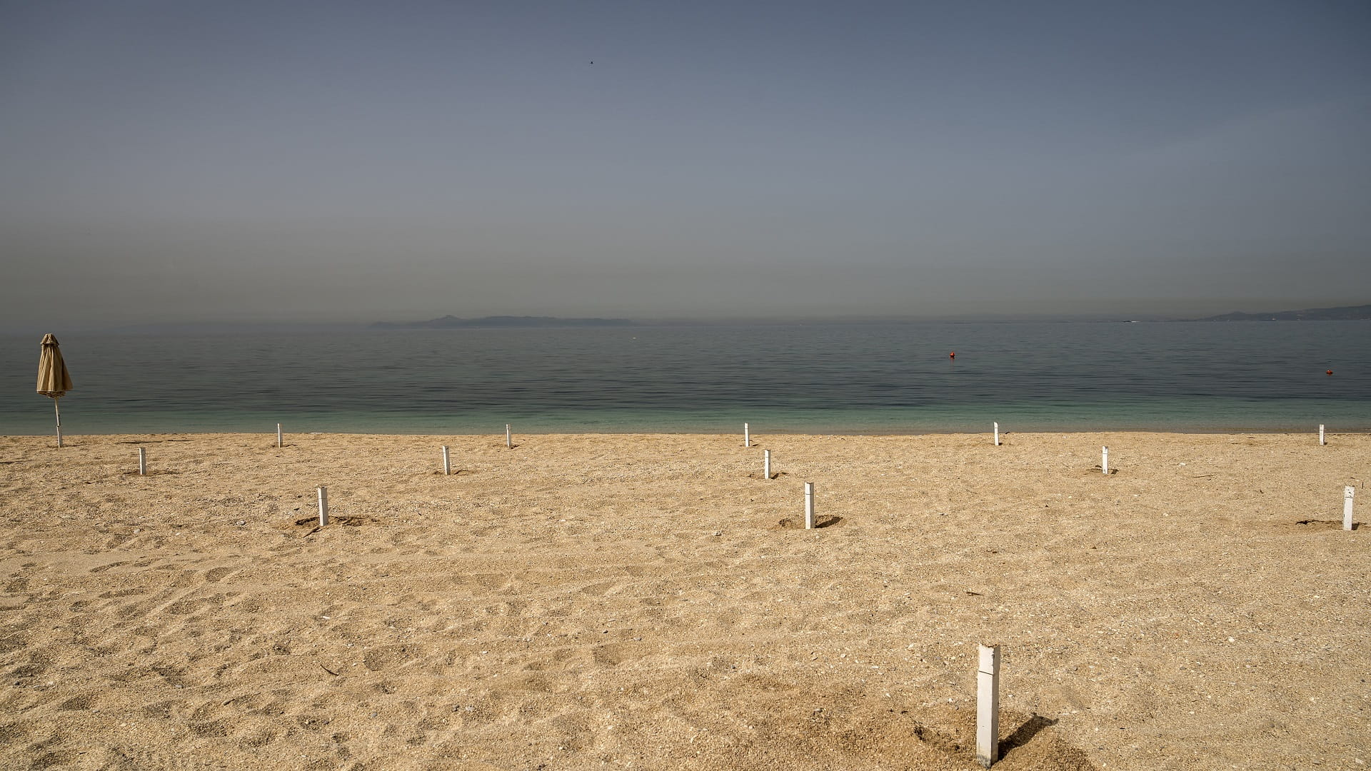 Image for the title: Greece to reopen beaches, museums after long lockdown 