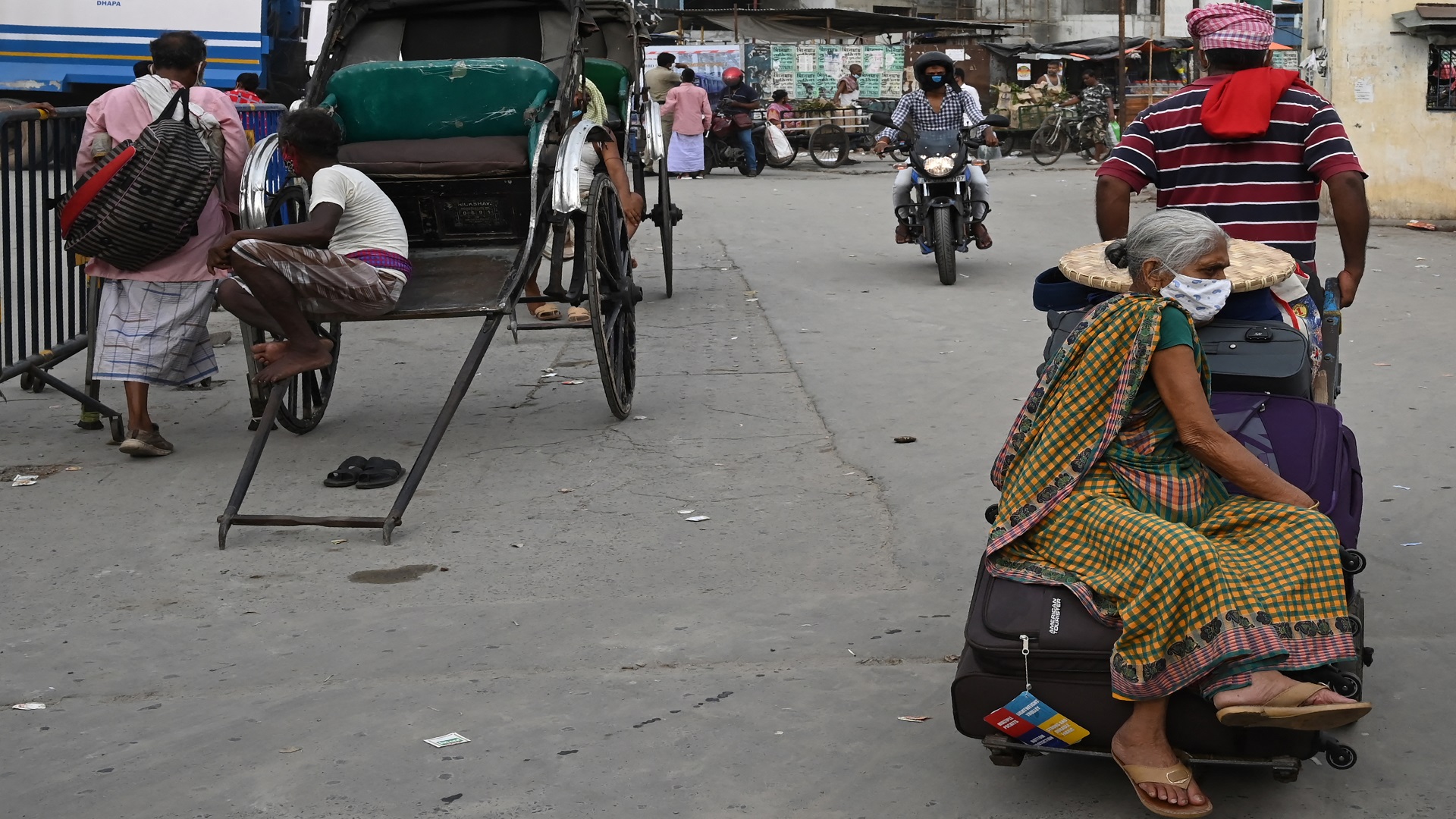 Image for the title: India cases lower but WHO says positive tests ominously high 