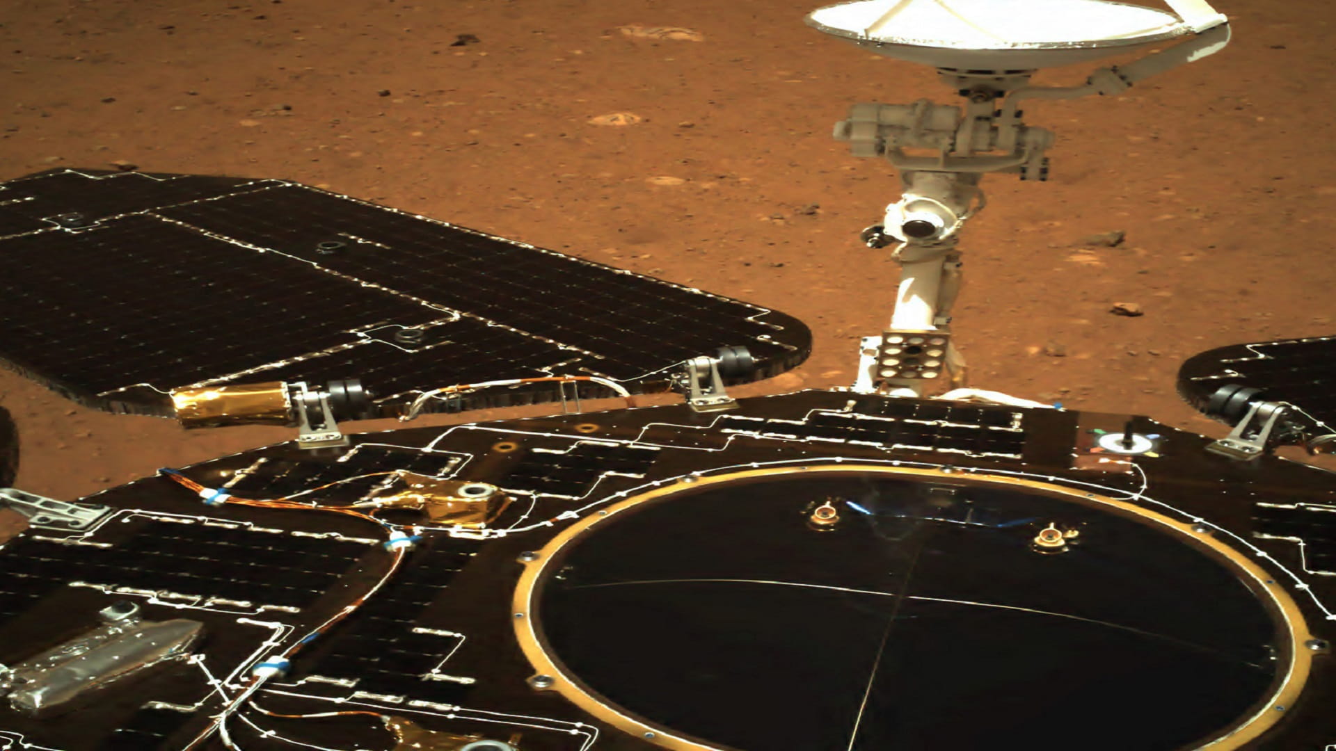 Image for the title: China: Martian rover takes first drive on surface of Red Planet 
