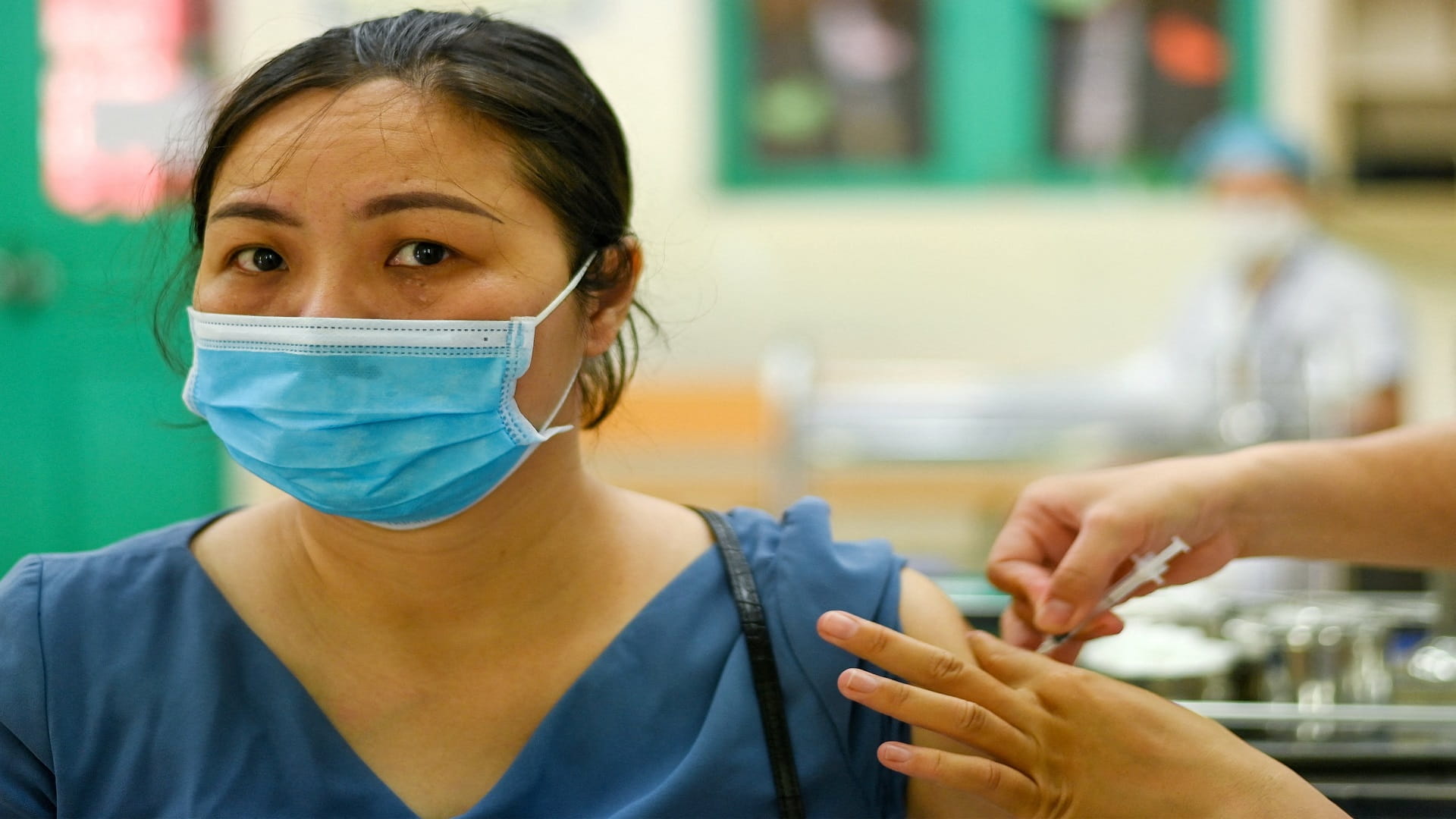 Image for the title: Vietnam reports record 9,690 COVID-19 infections on Sunday 