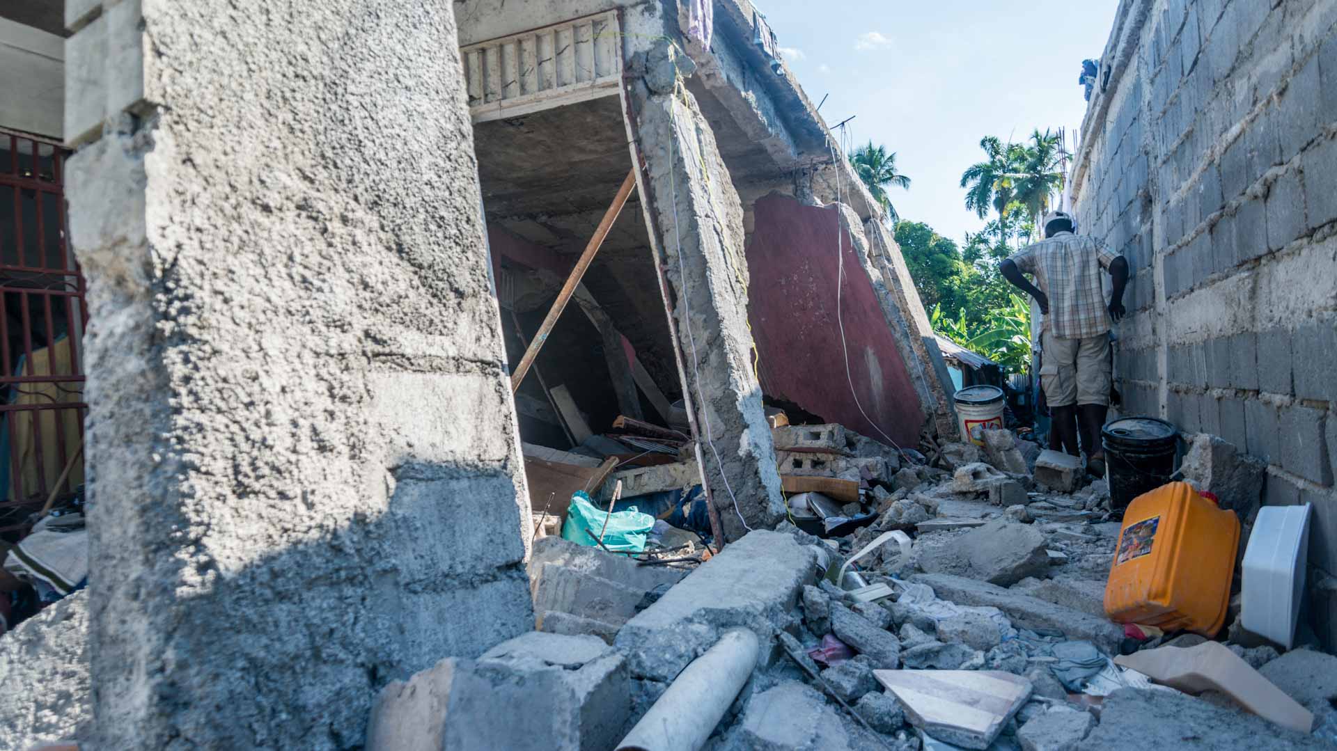 Image for the title: Rescuers race to find Haiti survivors as death toll hits 1,297 