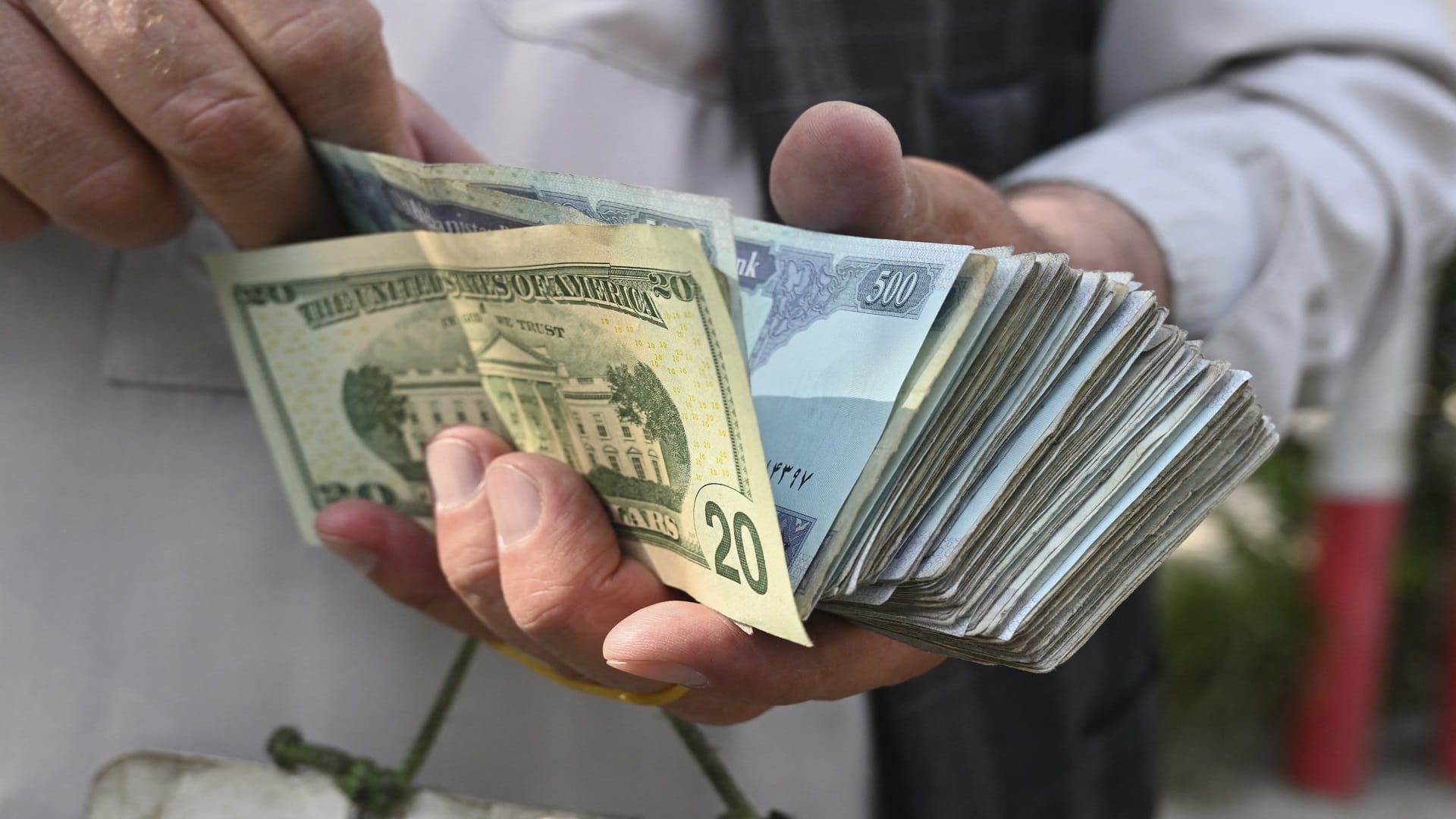 Image for the title: Afghan currency dives on Taliban takeover