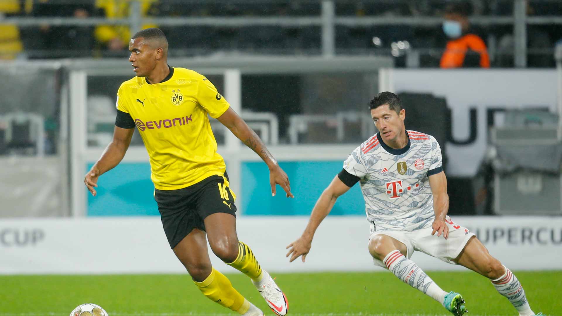 Image for the title: Lewandowski double downs Dortmund as Bayern Munich win Super Cup 