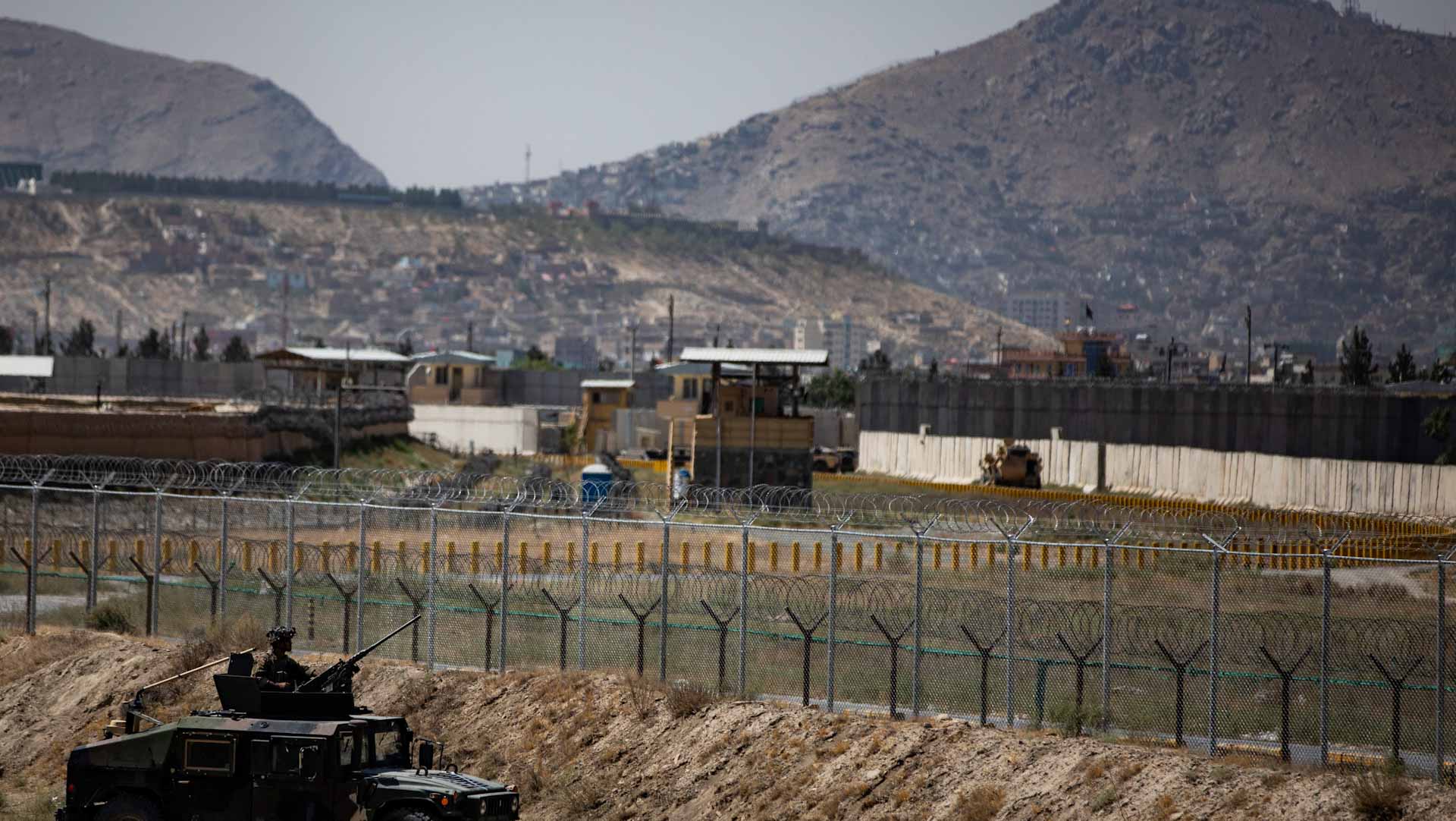 Image for the title: 5 dead, dozen wounded taken to hospital after Kabul airport blast 