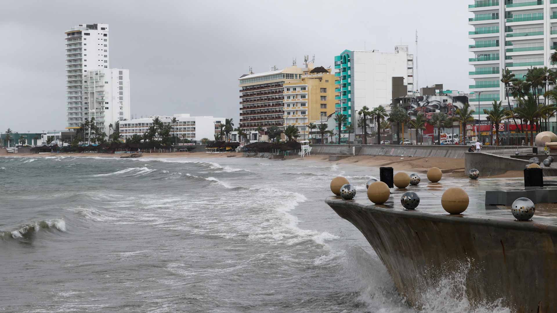 Image for the title: Nora, now tropical storm, kills boy in Mexican resort town 