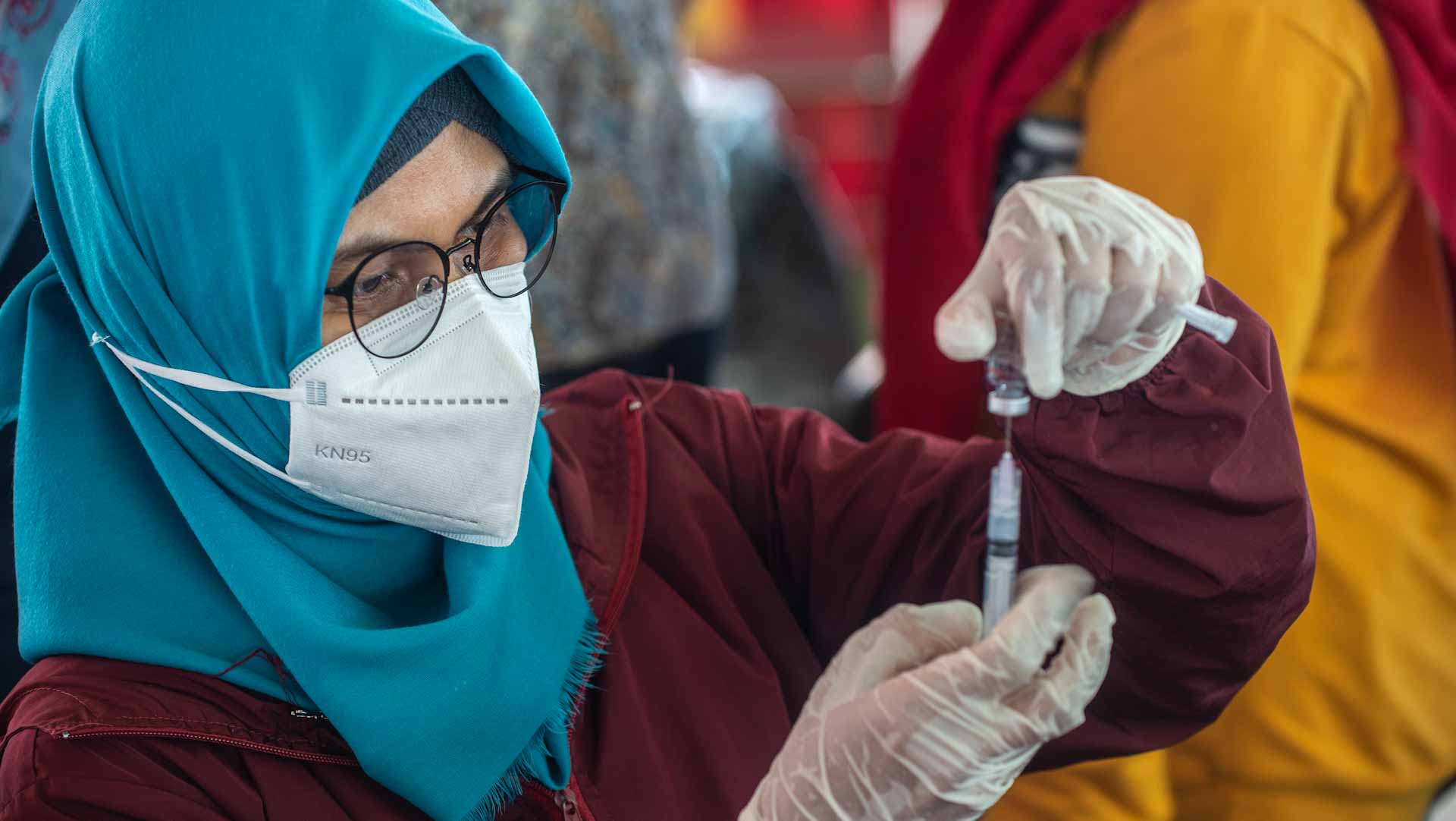 Image for the title: Indonesia tightens travel curbs as it braces for Omicron arrival 