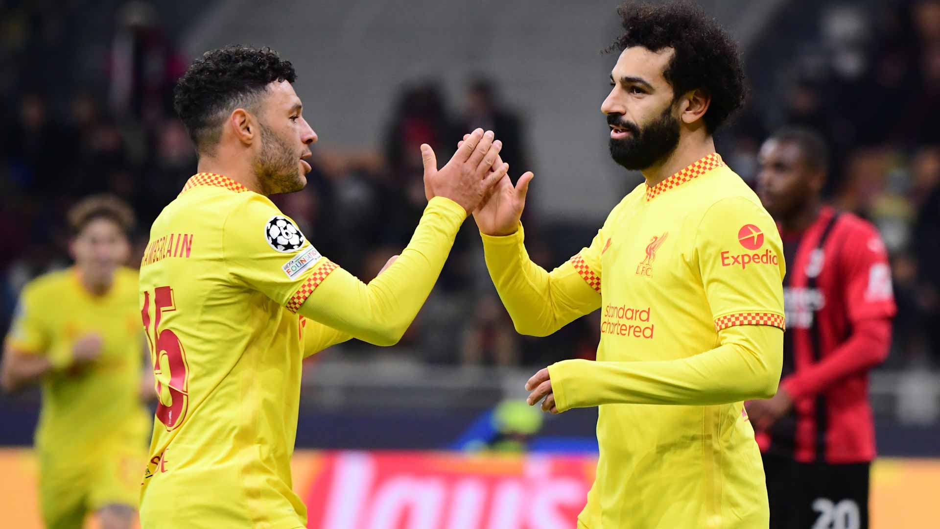 Image for the title: Liverpool eliminate Milan as Origi and Salah seal comeback win 