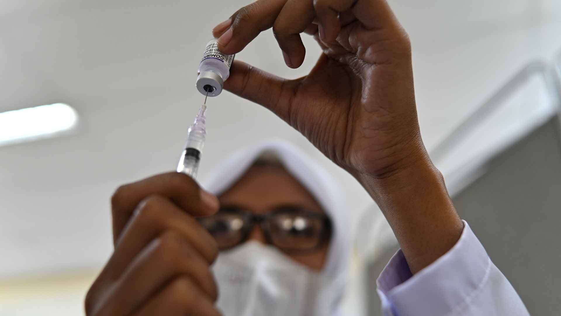 Image for the title: Indonesia to start vaccinating children aged 6-11 against COVID19 