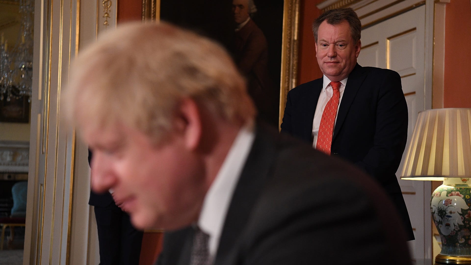 Image for the title: UK's former Brexit minister gives backing to PM Johnson 