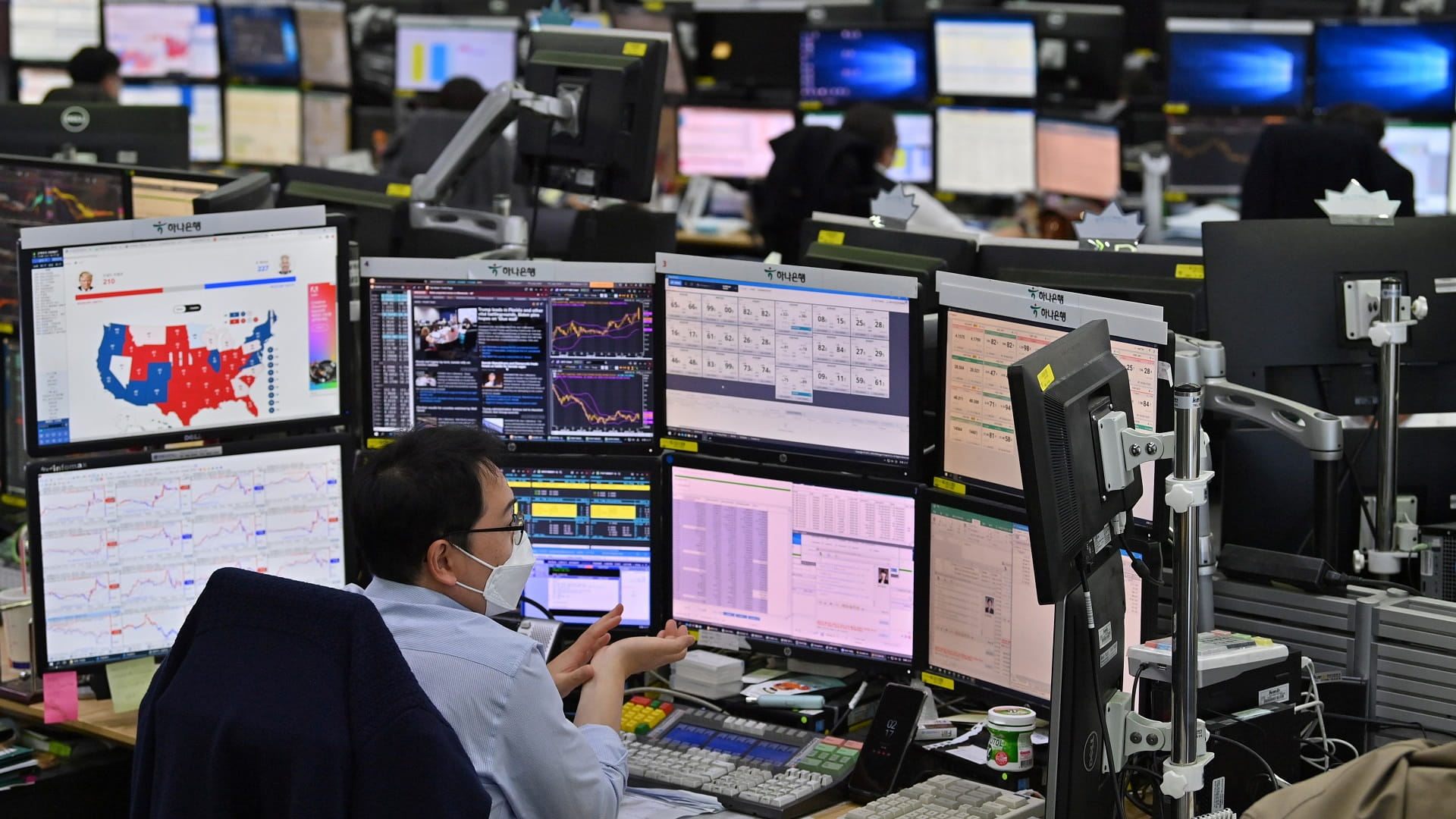 Image for the title: Most Asian markets build on rally but Omicron casts shadow 