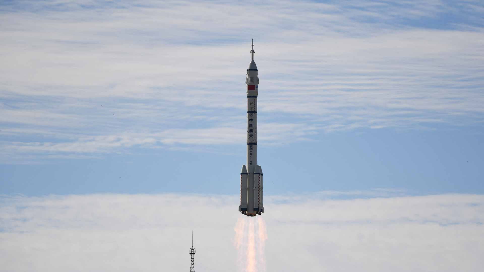 Image for the title: First astronauts at China's new space station conduct spacewalk 