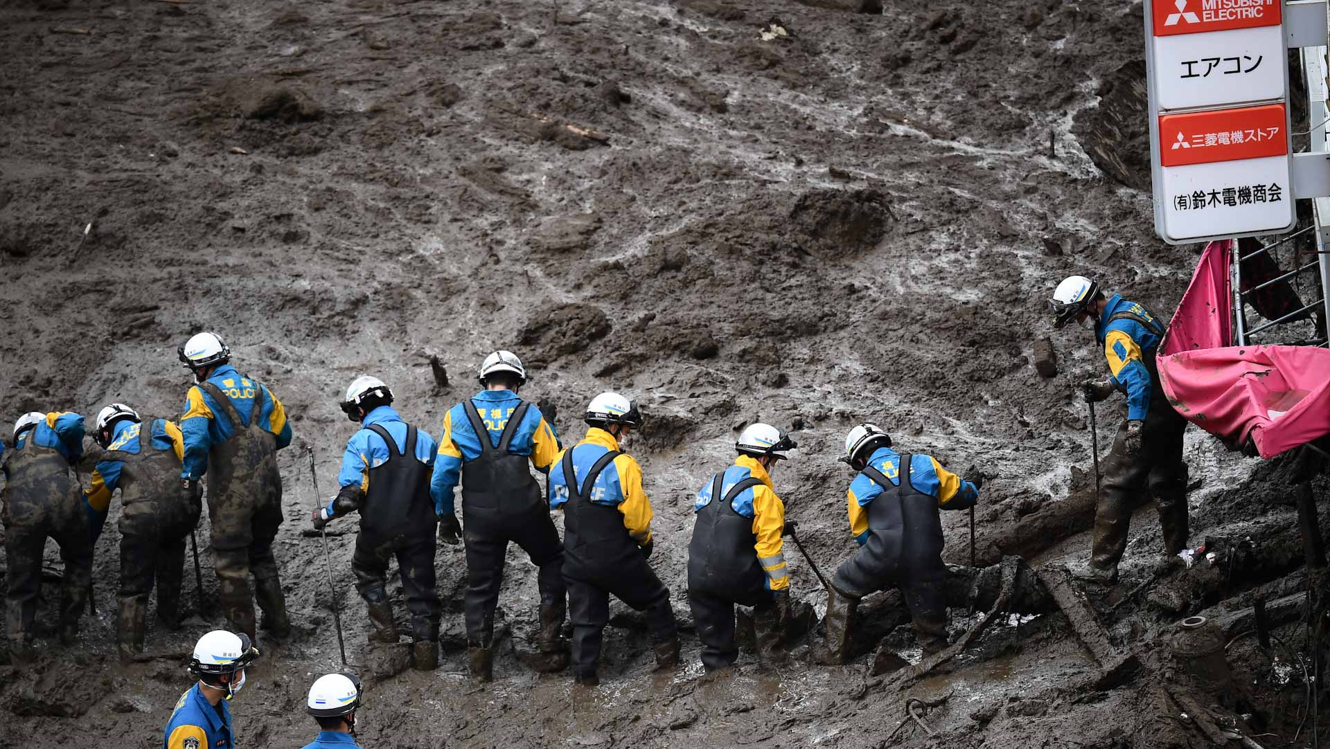 Image for the title: Rescuers fight time, weather in Japan landslide; over 100 missing 