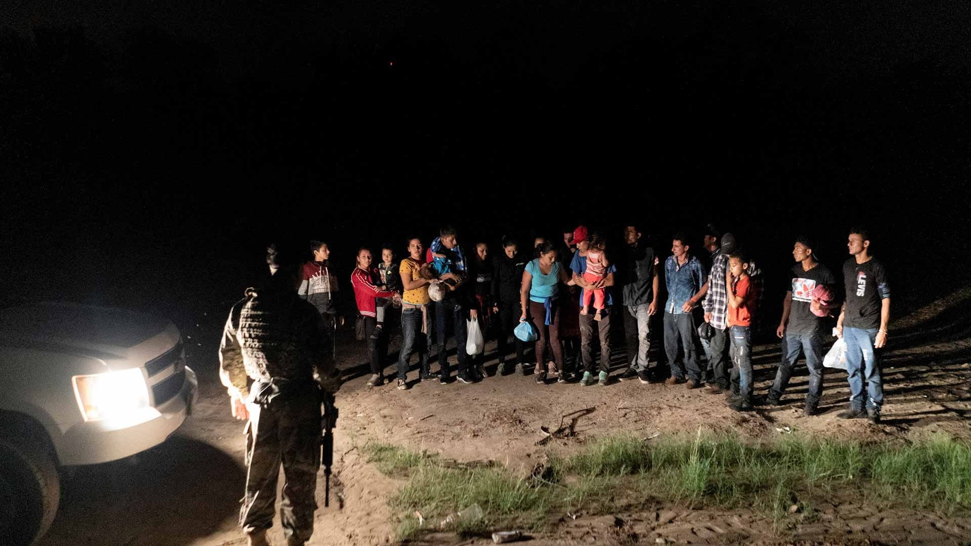 Image for the title: Nearly 600 rescued migrants disembark from charity boat in Italy 