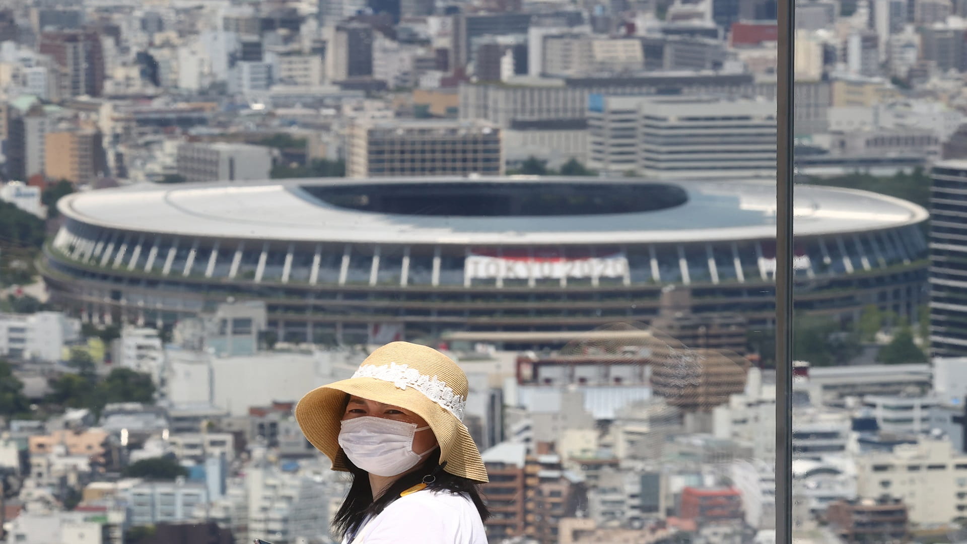 Image for the title: About 950 people to watch opening event at stadium, official says 