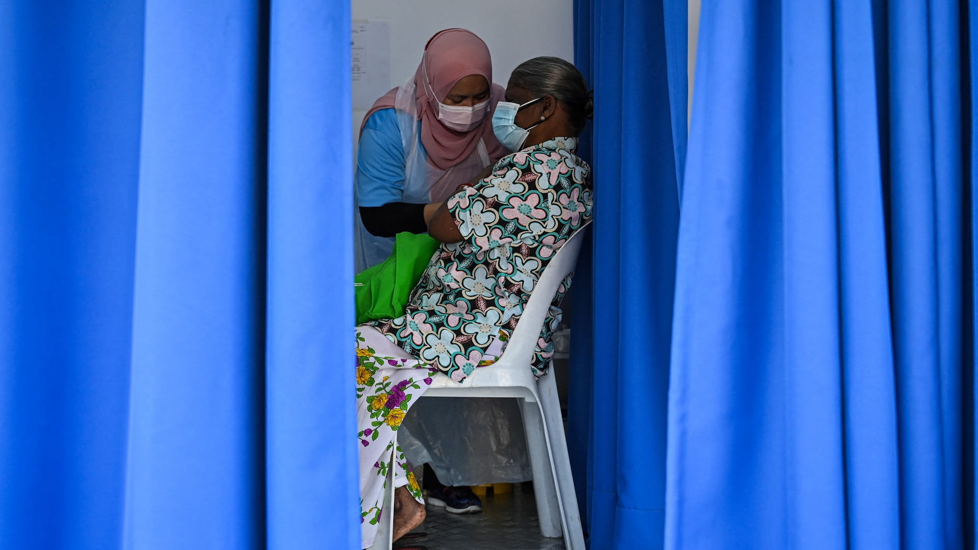 Image for the title: Malaysia reports record 15,902 new coronavirus cases 