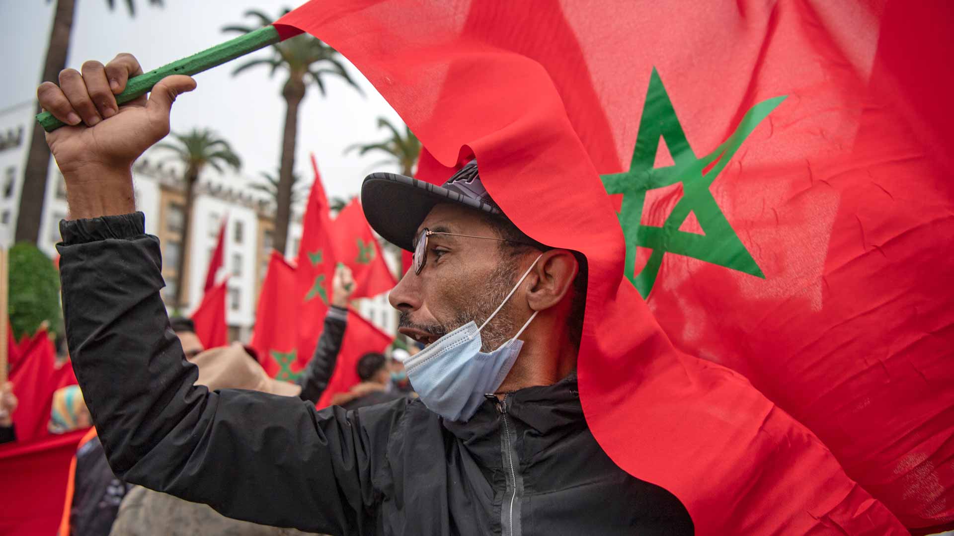 Image for the title: Moroccans rally against Covid health pass 