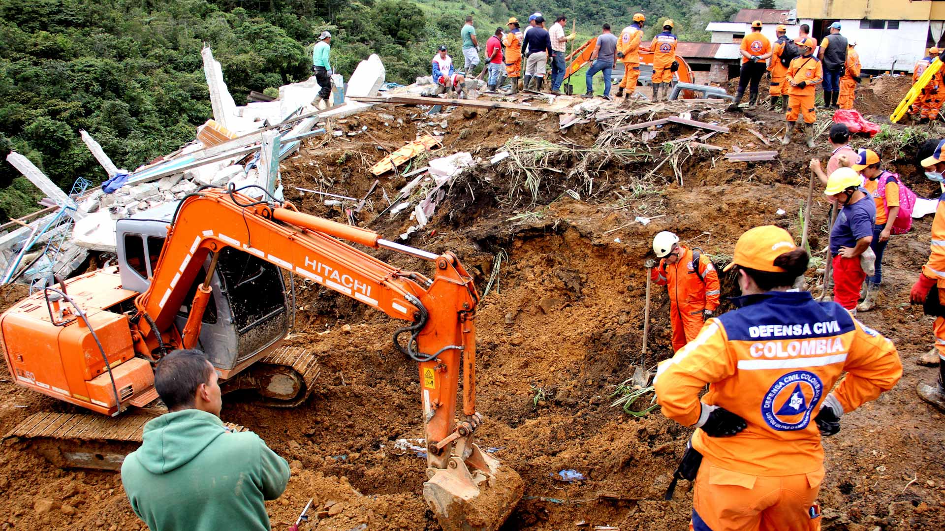 Image for the title: Landslide kills 11 in southern Colombia, others missing 