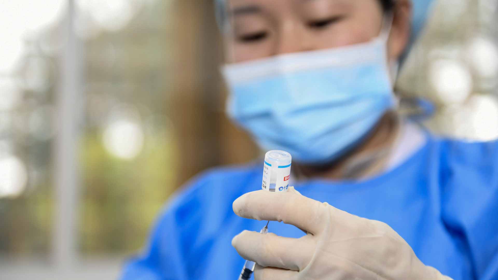 Image for the title: Mainland China reports 55 new COVID-19 cases vs 78 a day earlier 