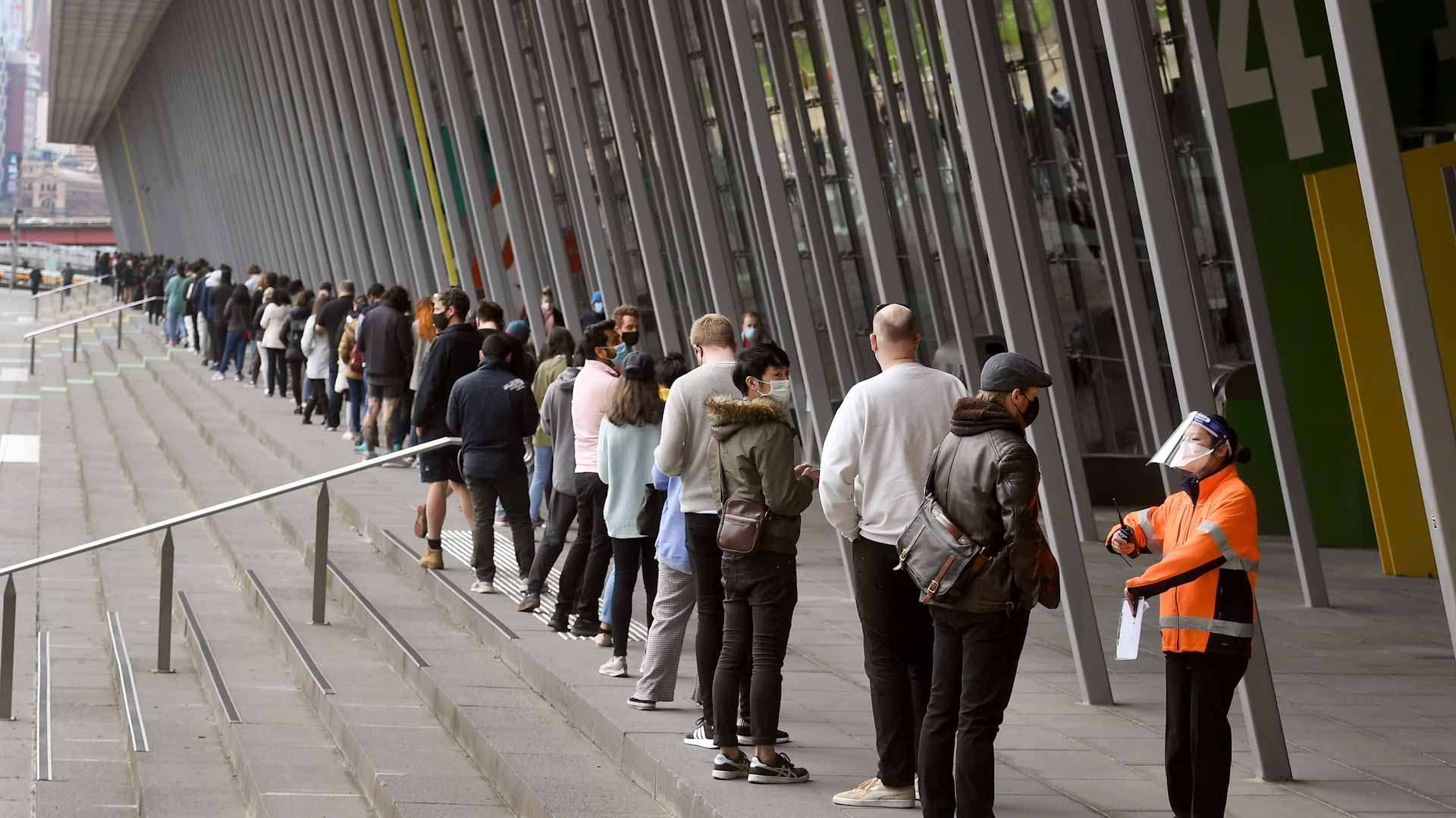 Image for the title: Australia begins vaccine booster rollout as more curbs ease 