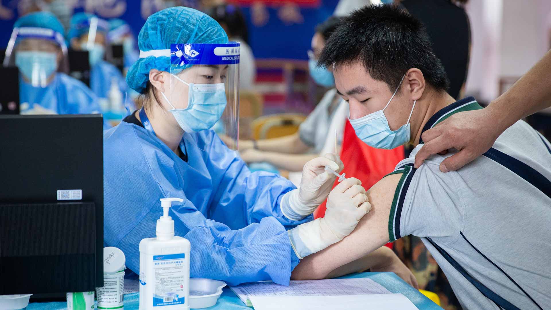 Image for the title: China records 52 new COVID-19 cases 