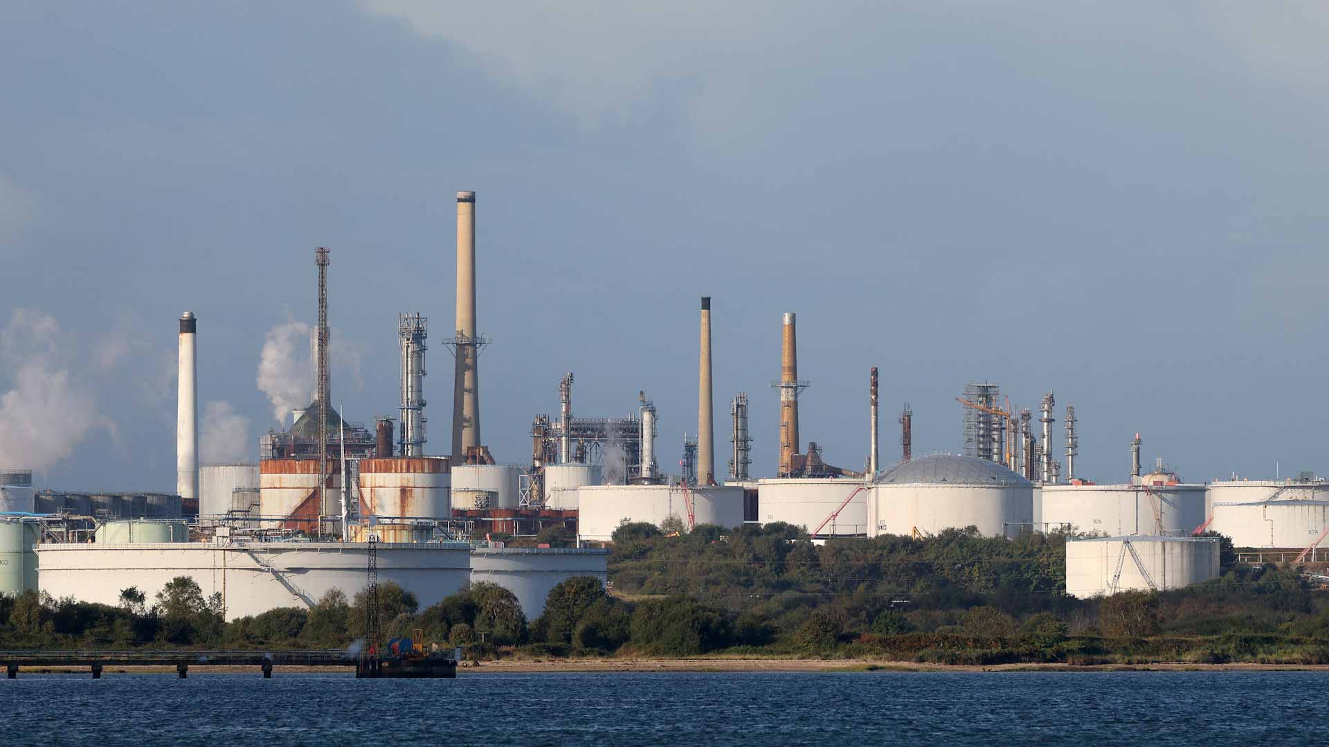 Image for the title: Oil prices slide as supply boost, weaker demand fears weigh 