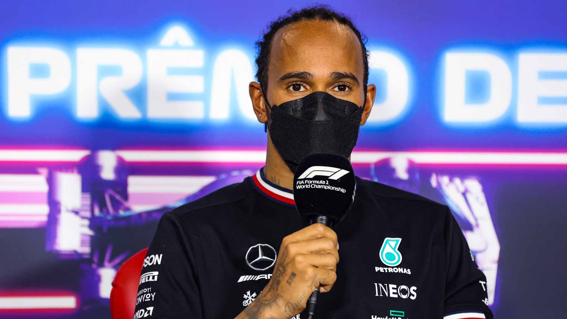 Image for the title: Hamilton in trouble with stewards over safety belt breach 