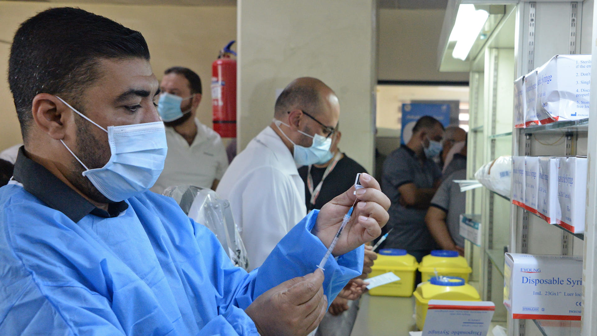 Image for the title: Iraq gets 1.2 million doses of Pfizer Covid vaccine 