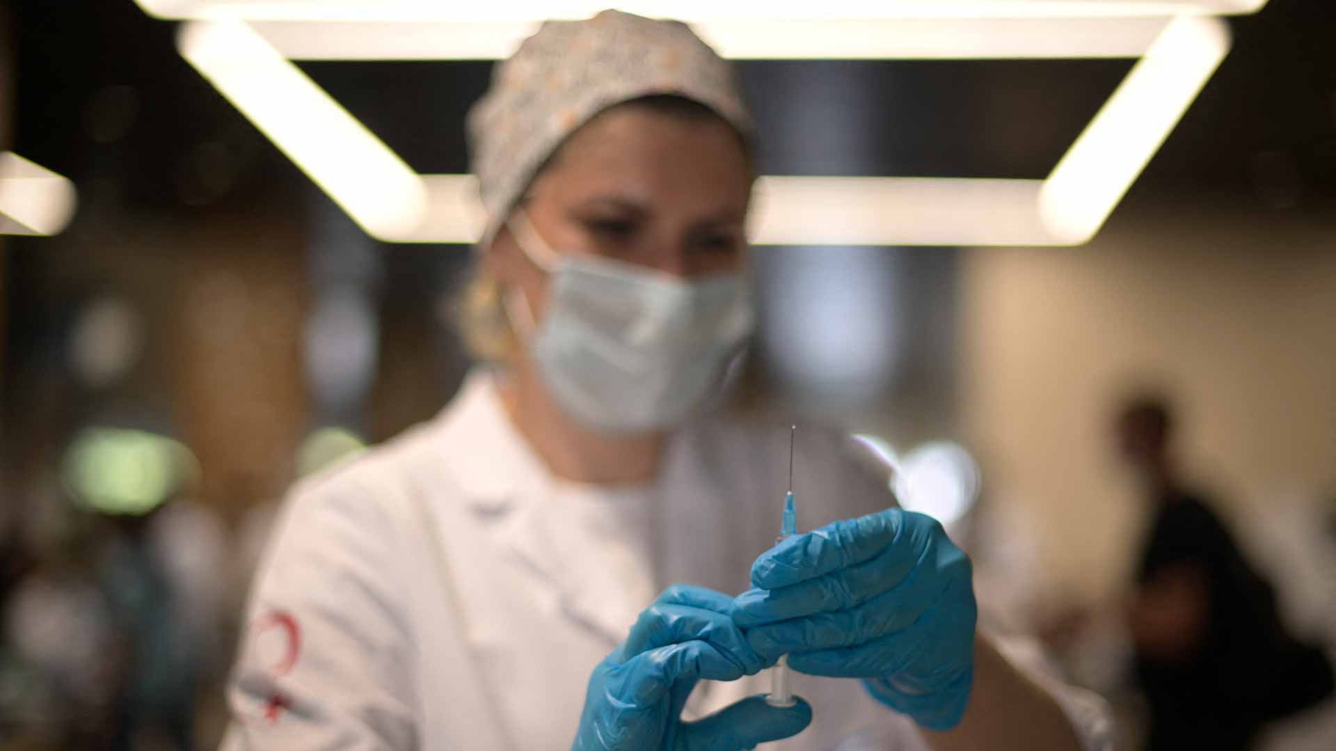 Image for the title: Russia reports record daily death toll from COVID-19 