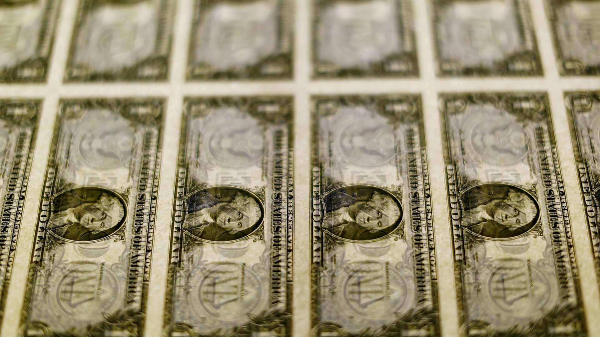 Image for the title: Dollar edges up as energy surge drives inflation worries 