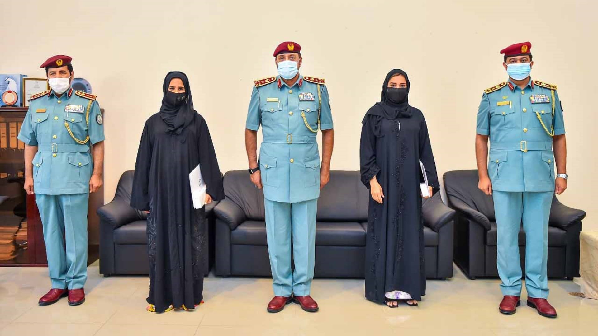 Image for the title: Brigadier General Abdullah bin Amer honours two volunteers  