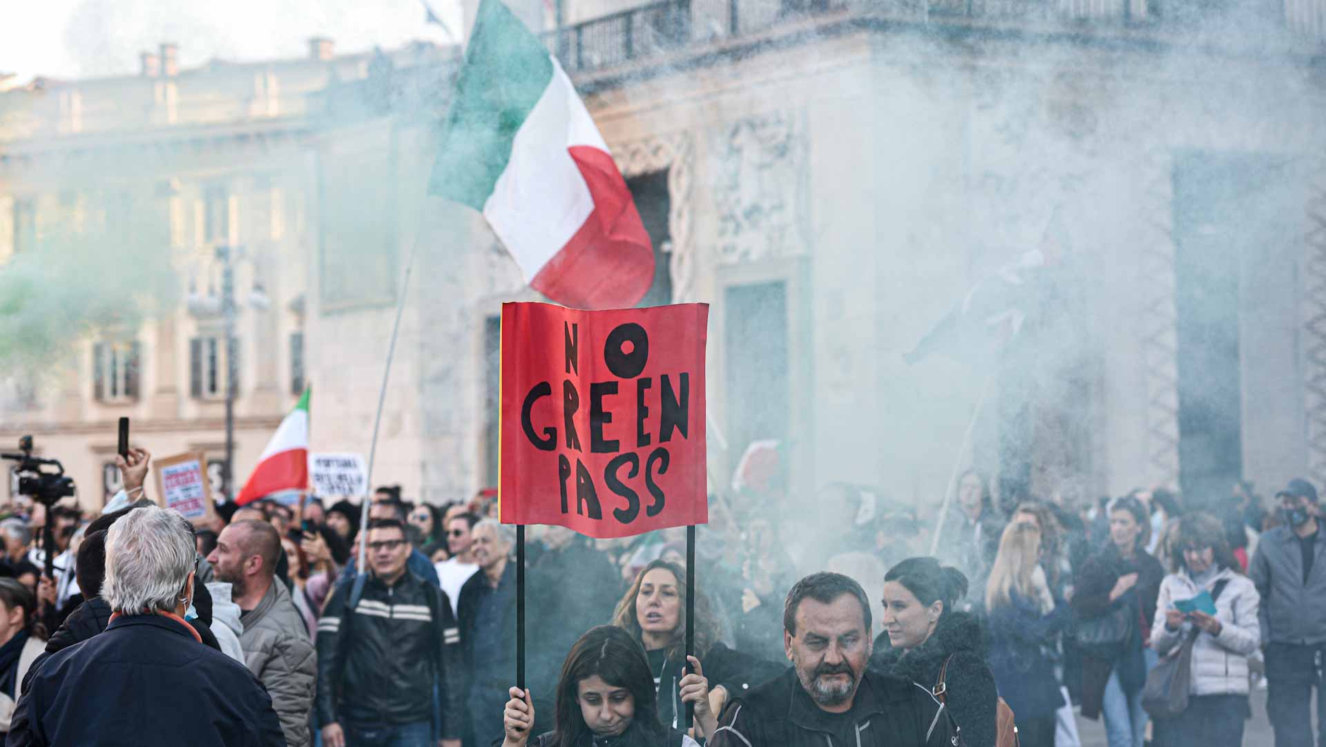 Image for the title: Italian police use water cannon on port protesters 
