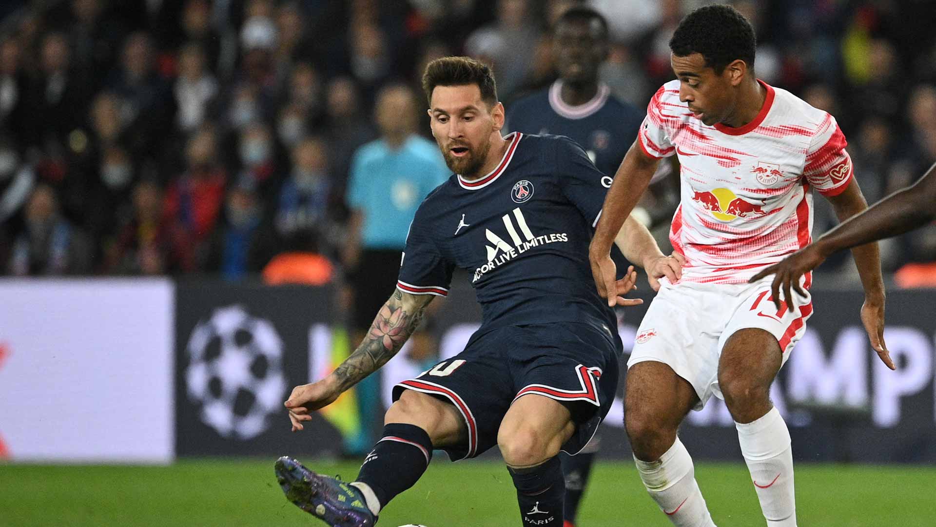 Image for the title: Messi double act earns PSG comeback win against Leipzig 