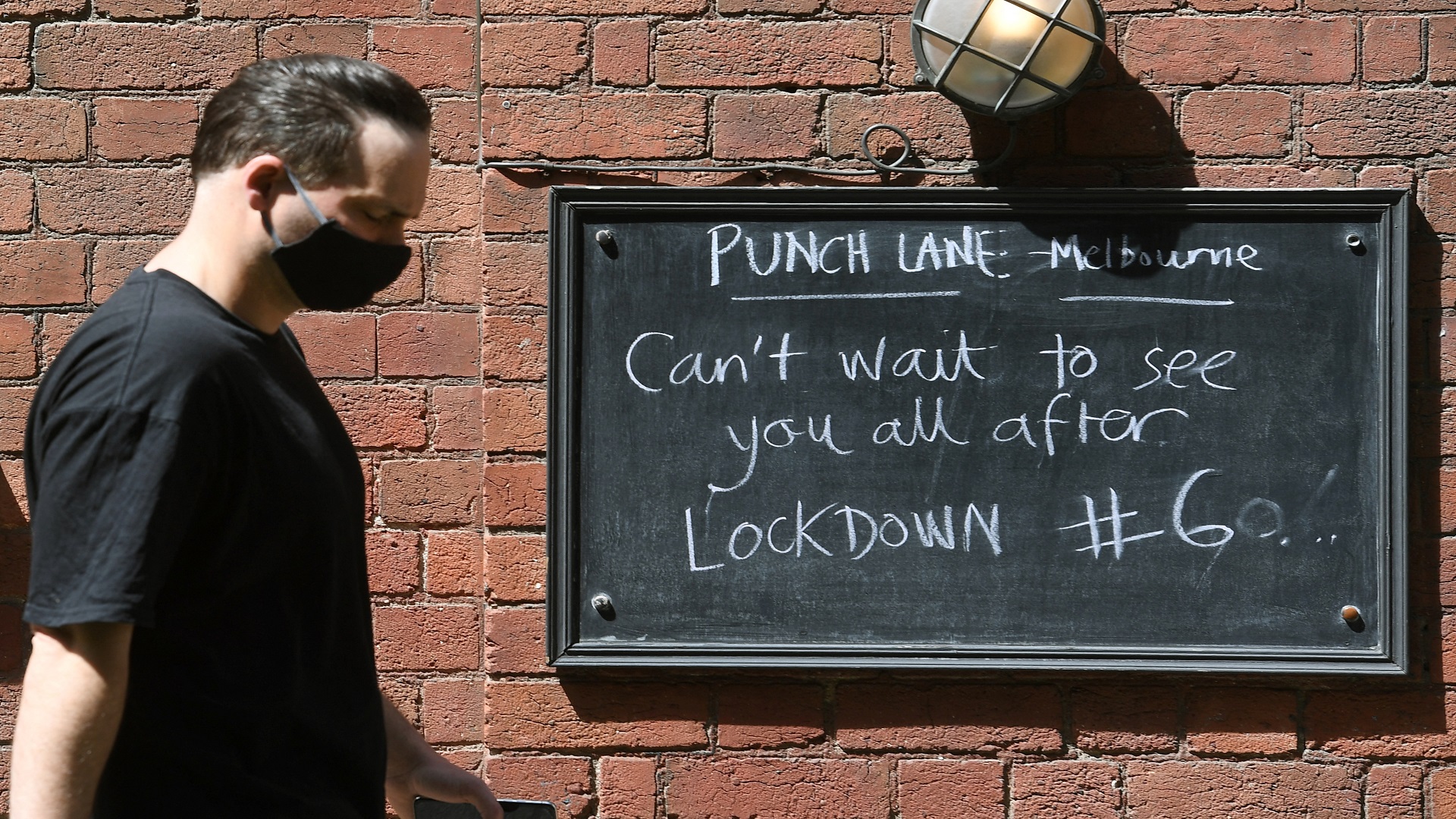 Image for the title: Melbourne reopens as world's most locked-down eases restrictions 