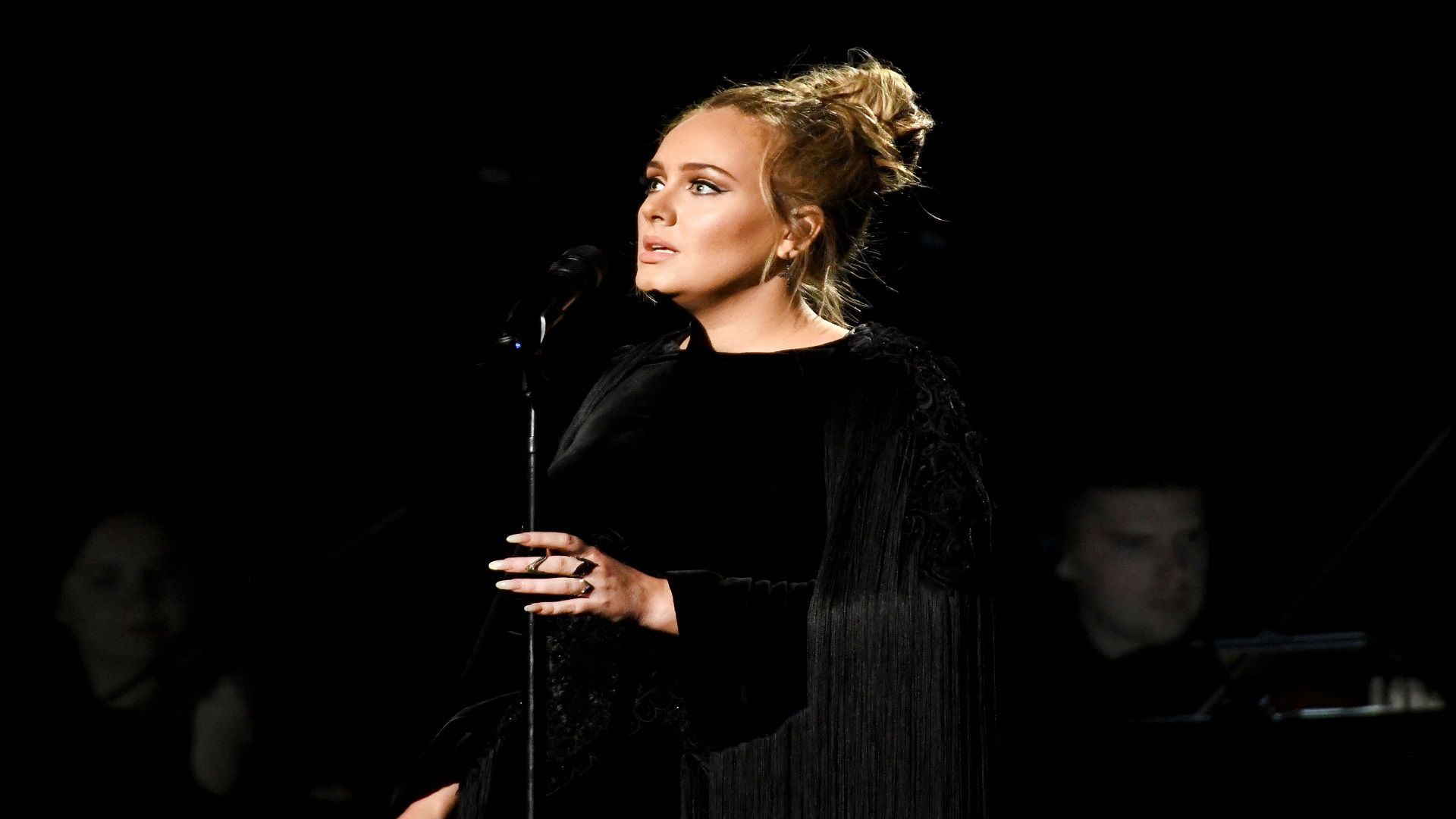 Image for the title: Adele storms back to top of UK charts with comeback single 