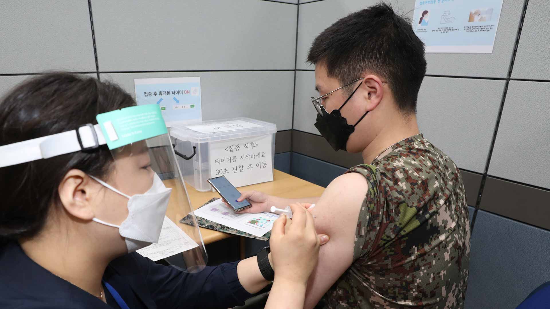 Image for the title: South Korea plots course to scrapping COVID curbs by early 2022 