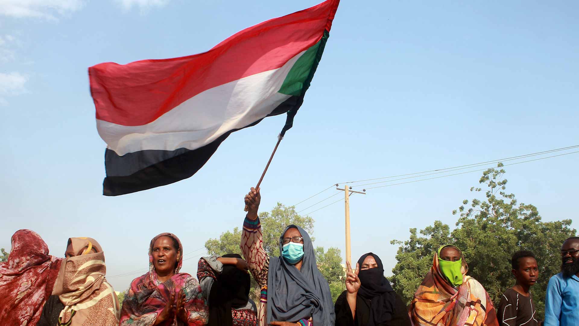 Image for the title: Sudanese protest into night after general ousts government 