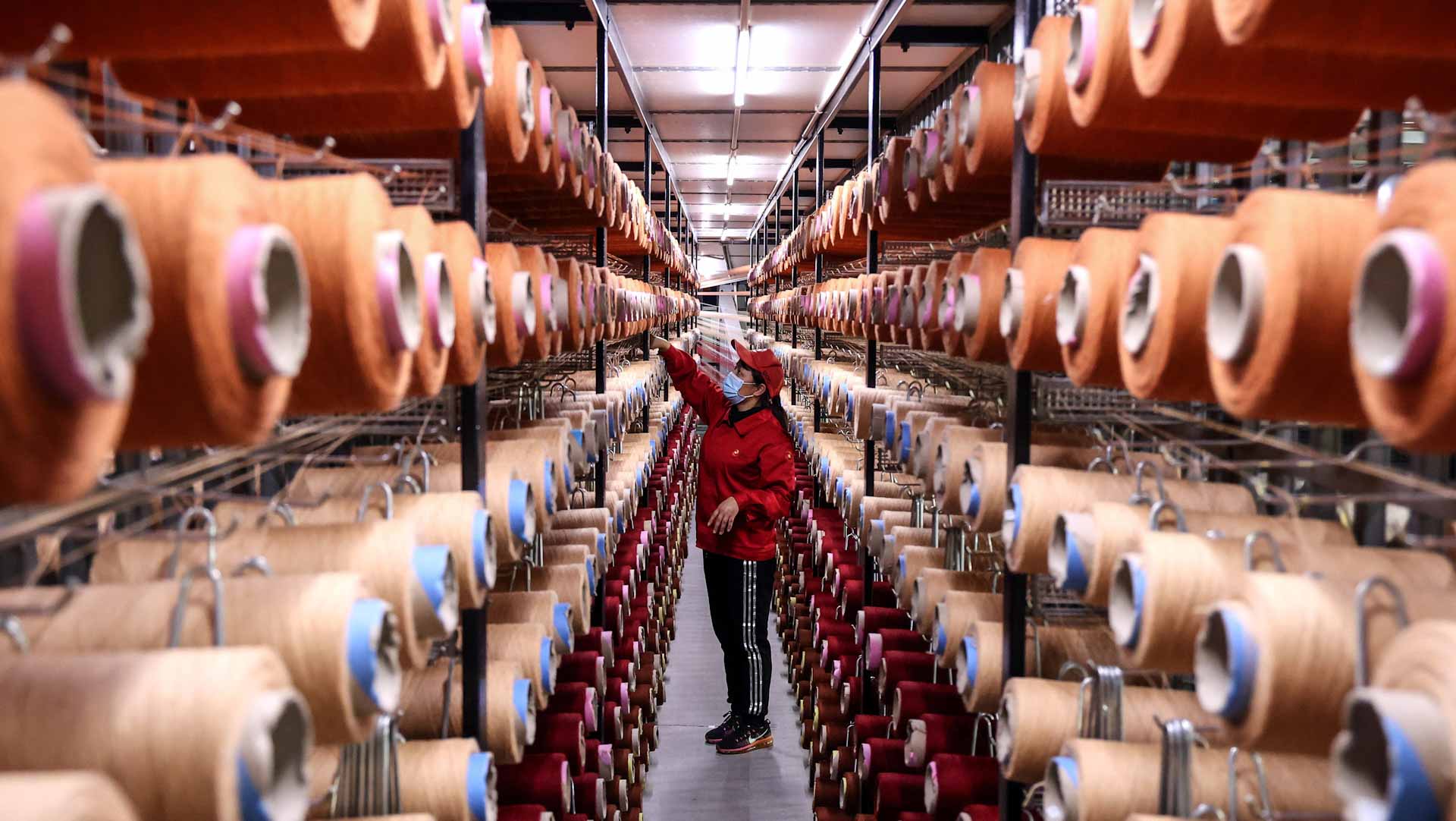 Image for the title: China's falling factory activity a sign of economic woes ahead 