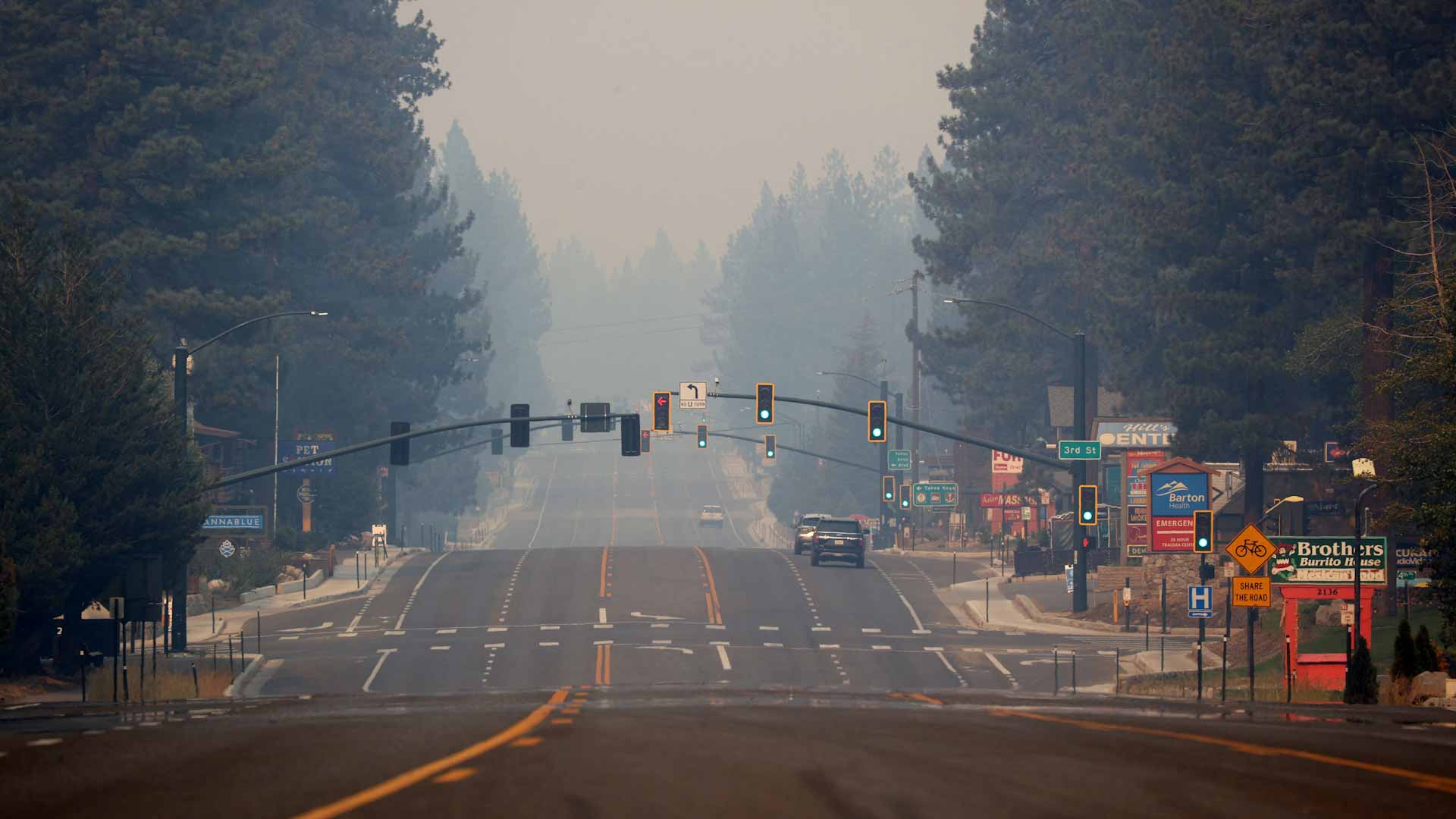Image for the title: Crews save California town near Lake Tahoe; wildfire rages on 