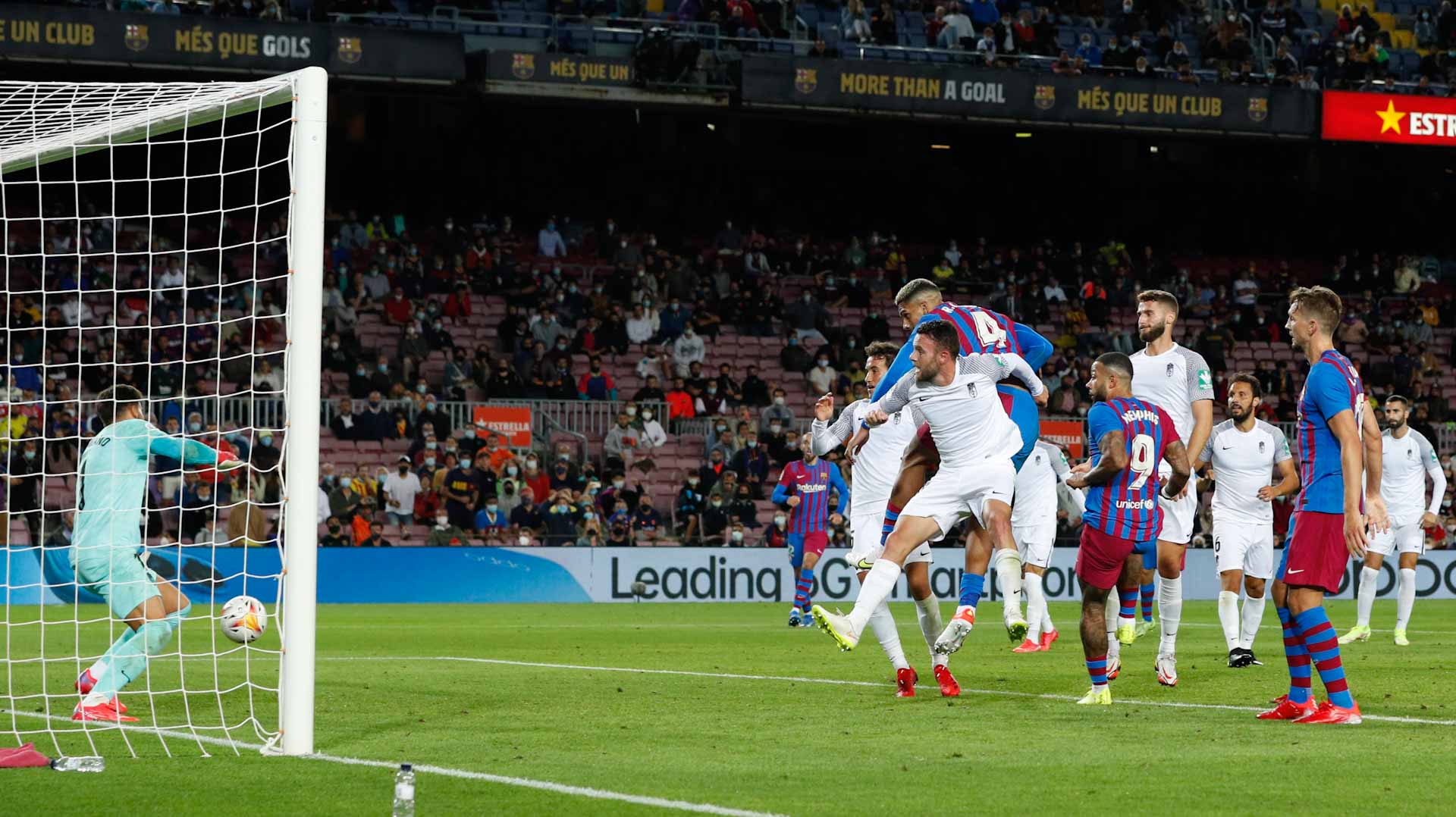 Image for the title: Barca scrape late draw with Granada as fans stay away 