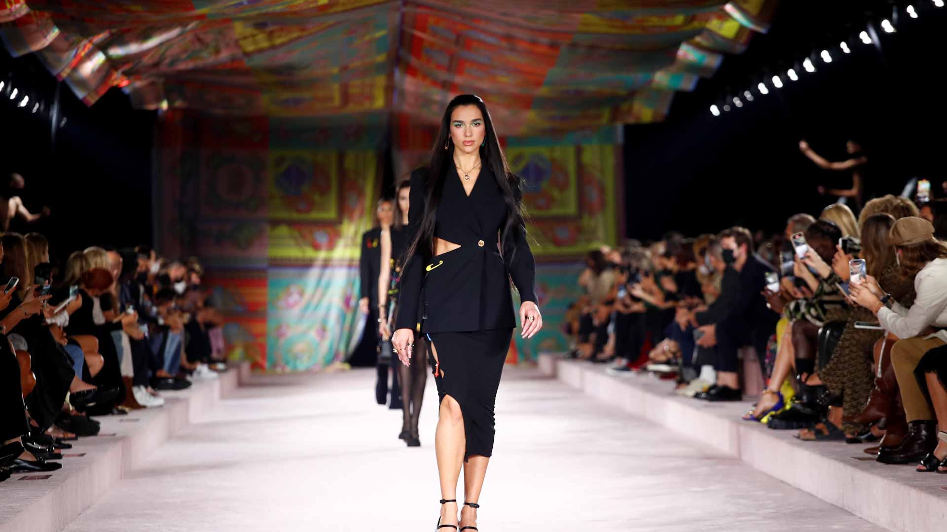 Image for the title: Dua Lipa opens Versace's Milan Fashion Week show 
