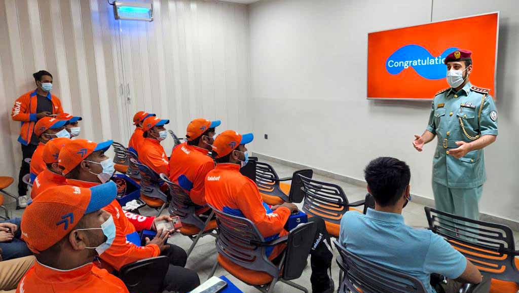 Image for the title: Sharjah Police honours a number of Talabat drivers 