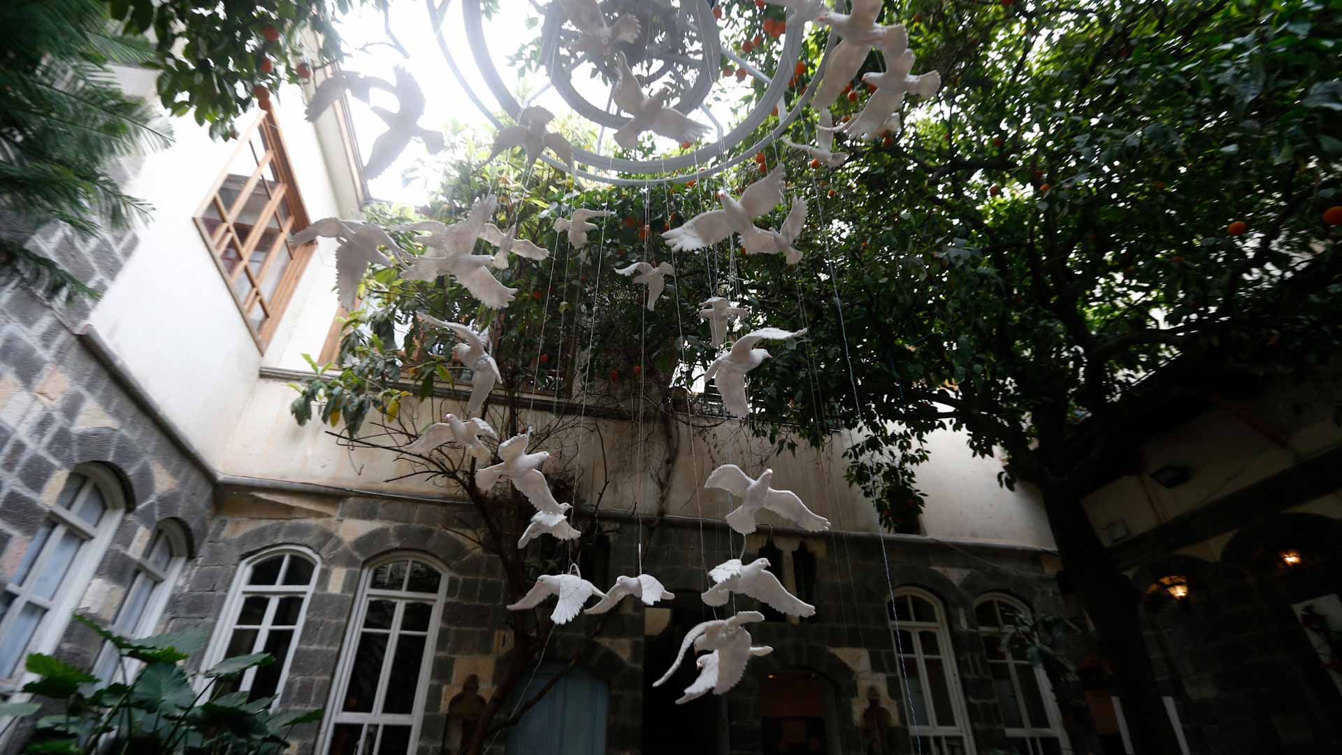 Image for the title: Damascus art installation turns ceramic doves into war symbol 